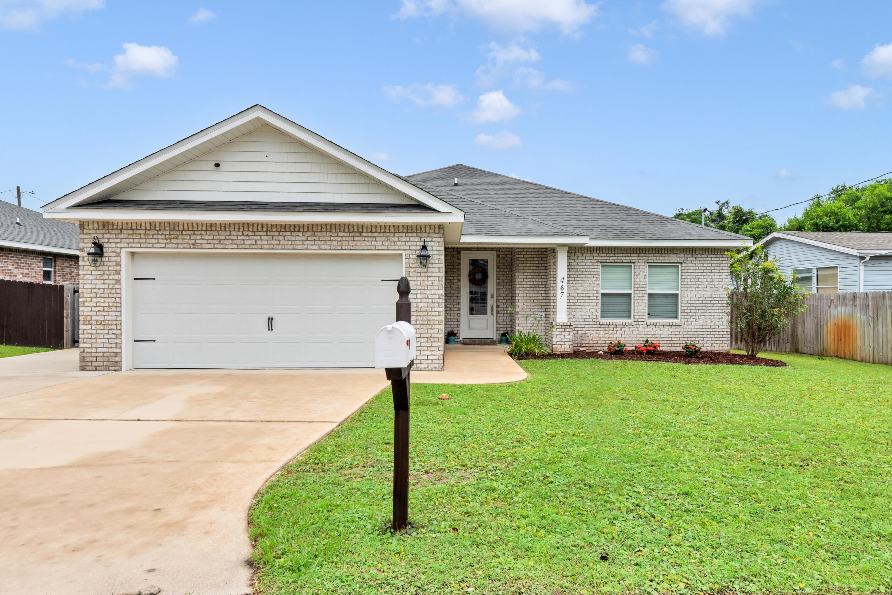 Beautifully updated and impeccably maintained, this contemporary home blends modern comfort with stylish design. The inviting kitchen features gorgeous granite countertops, sleek stainless-steel appliances, a convenient breakfast bar, and a charming dining area perfect for everyday living.

The spacious primary suite offers a luxurious retreat with a beautifully tiled walk-in shower with updated glass enclosure, dual walk-in closets, and an elegant tray ceiling. Plush carpeting adds warmth to the bedrooms, while attractive tile flooring flows seamlessly throughout the main living areas.

Step outside to enjoy the thoughtfully enhanced backyard, featuring a fully fenced yard, professionally screened-in patio, sprinkler system, premium artificial turf, and a custom putting green. Additional concrete parking provides ample space for a boat, RV, or entertaining guests.

Ideally located just minutes from the area's stunning beaches and nearby Hurlburt Field, this exceptional property offers the perfect combination of convenience, functionality, and lifestyle.