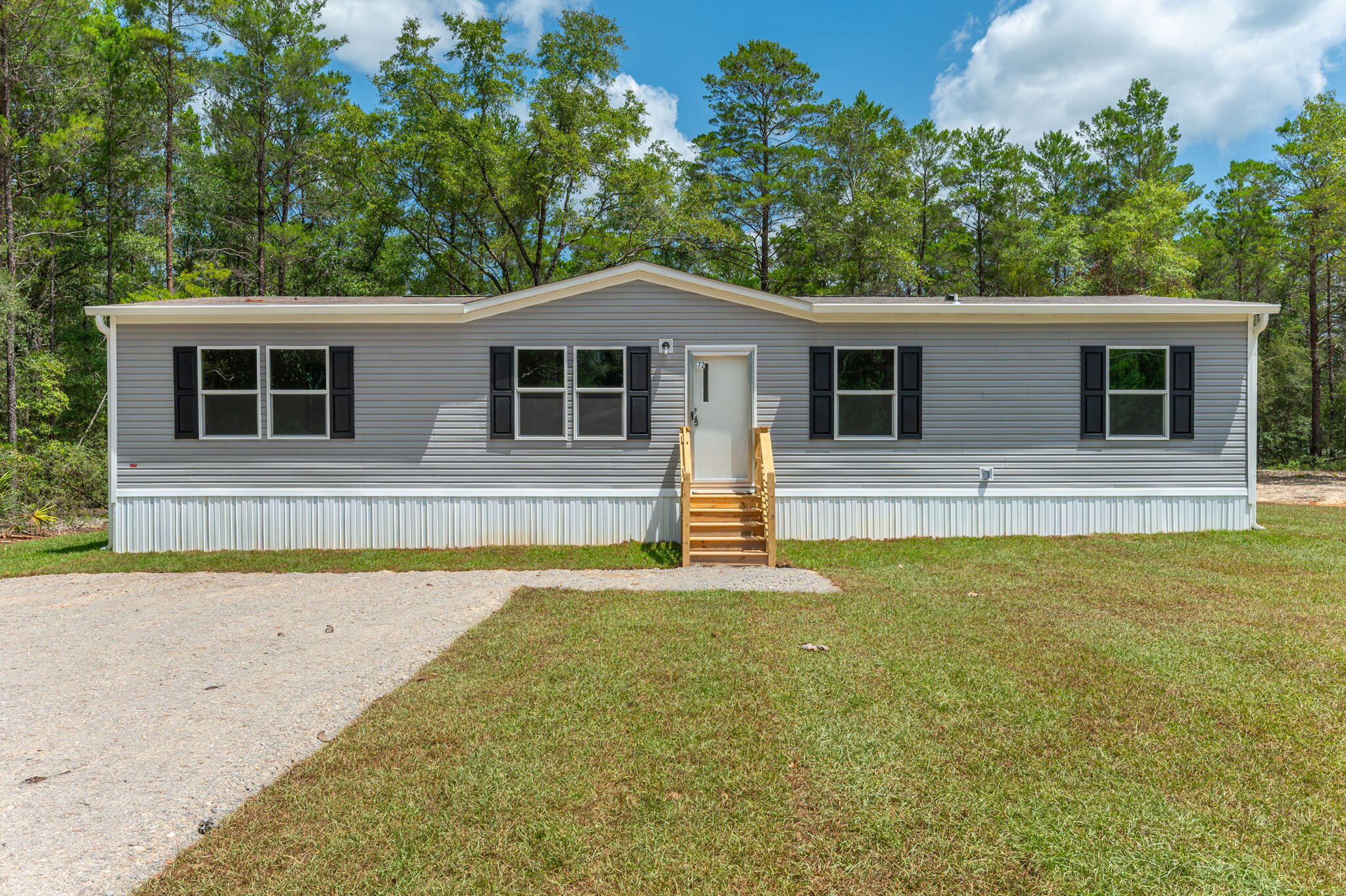 $5,000 Seller Closing Cost Credit with Acceptable Offer! Don't miss this brand new 4-bedroom, 2-bath home located in the growing Mossy Head area. This thoughtfully designed split-bedroom floor plan features durable, no-carpet flooring throughout, a spacious primary suite, and an open-concept living area that offers flexible space for both everyday living and entertaining. The oversized dining area can easily accommodate large gatherings or be utilized as an additional living space overlooking the backyard.
Situated on a .23-acre lot, the exterior has been enhanced with a fully sodded yard and an oversized gab rock parking pad/driveway, providing ample parking and added functionality.
Conveniently located just 15 minutes from the heart of DeFuniak Springs, approximately 45 minutes from the sugar-white beaches of Destin, and within an easy commute to Eglin AFB, Duke Field, and other area military installations, this home offers the perfect combination of comfort, convenience, and value. Schedule your private showing today!