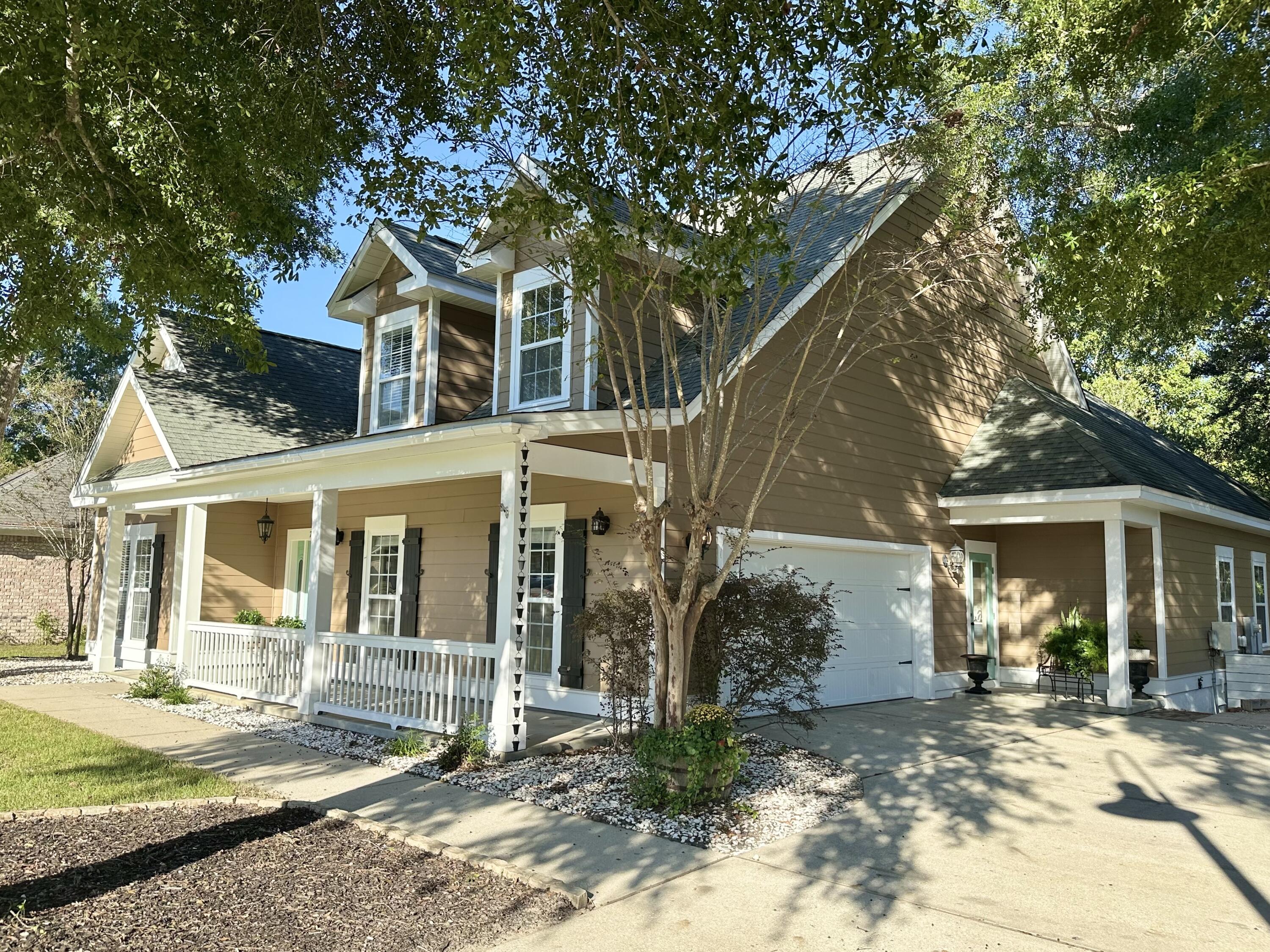 PRICE REDUCED with a $10,000 financial credit to buyers at closing with acceptable offer! All offers considered on this charming custom-built home in the Hammock Bay community of Freeport, where resort-style amenities and a true neighborhood lifestyle exist. Step inside to a formal foyer and formal dining room, leading to an open living area filled with natural light and hardwood floors. The spacious great room opens to a covered patio and an expansive custom deck overlooking a serene preserve offering the perfect backdrop for relaxing or entertaining. The primary suite and two guest bedrooms are conveniently located on the main floor, while the second level features two guest bedrooms, a full bath, and a versatile bonus room ideal for an office or extra storage. Thoughtful upgrades throughout and quality finishes make this home truly stand out.
New wall oven and microwave 2025, freshly replaced/sealed deck, and recently painted inside and exterior painted within the last 3 years make this home is move-in ready.

Inside Hammock Bay, residents enjoy miles of walking trails, clubhouse, fitness center, sports courts, pools, a dog park, playgrounds, community events, and access to the Bay. Start your mornings with coffee on the spacious front porch and soak in the charm of this beautiful community. Homeowner is a licensed FL Real Estate Agent. Reach out for a private showing today!