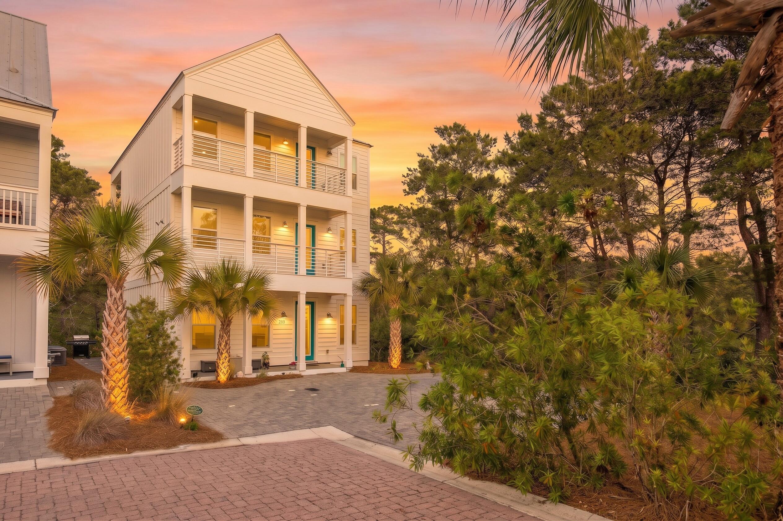 Positioned on a premium, oversized homesite in the northeast corner of Serenity at Dune Allen, this never-rented, three-story residence offers a rare blend of privacy, functionality, and income potential along 30A's west end. Bordering green space to the north and east, the property enjoys a peaceful natural setting just a short walk from the beach.
Four spacious bedrooms -- each with a private ensuite bath and porch access -- support strong rental projections exceeding $100,000 annually, making the home equally attractive as an investment property, second home, or primary residence. A fifth half bath rounds out the floor plan, while extended parking for up to six vehicles adds a rare, sought-after amenity in the 30A market. The main level features raised ceilings and an open-concept layout connecting the chef's kitchen, dining area, and living space, all finished with coastal-inspired touches. Upstairs, the second and third floors each include two ensuite bedrooms plus flexible bonus areas suited to a home office, reading nook, or bunk room. Over 1,100 square feet of covered porches -- including a screened rear patio -- extend living space across all three levels.
Community pool access, proximity to the beach, and one of Serenity's most desirable homesites complete this exceptional offering, combining privacy, flexibility, and coveted 30A lifestyle appeal.