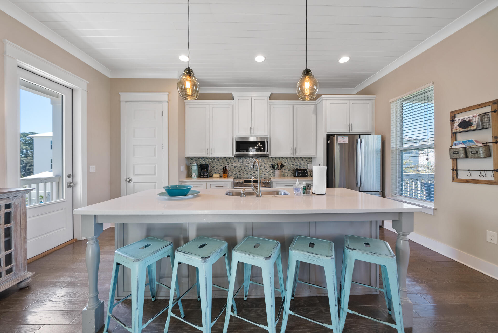 NO HOA FEES! MOTIVATED SELLERS! Welcome to 51 Abbey Road, a stunning 4-bedroom, 4.5-bath, 3-story coastal retreat perfectly positioned along scenic 30A in Santa Rosa Beach. Ideally located at the junction of Hwy 393, this home offers easy access to Hwy 98 and is less than half a mile from public beach access, local restaurants, and boutique shops making it a prime choice for both full-time living and a high-performing vacation rental. Step inside to find a bright, open-concept layout designed for modern coastal living. The main living area, located on the second floor, features the living room, dining space, and kitchen all seamlessly connected for effortless entertainment. The kitchen showcases a large island with sink and breakfast bar, stainless steel appliances, natural stone countertops, and ample cabinetry overlooking the living room. This home offers multiple covered balconies on the front and back perfect for enjoying the Gulf breeze and a paver driveway and back patio for easy maintenance and added curb appeal. The bedrooms are conveniently located on the first and third floors, with the primary suite on the top level featuring a private balcony, spacious ensuite bathroom with a glass-door tiled walk-in shower, and double vanity. Additional highlights include a metal roof, fully furnished interior including washer/dryer and patio furniture, and laundry on the main level for convenience. Situated just across from the emerald waters and sugar-white sands of the Gulf, 51 Abbey Road captures the best of 30A living luxury, location, and laid-back coastal charm all in one.