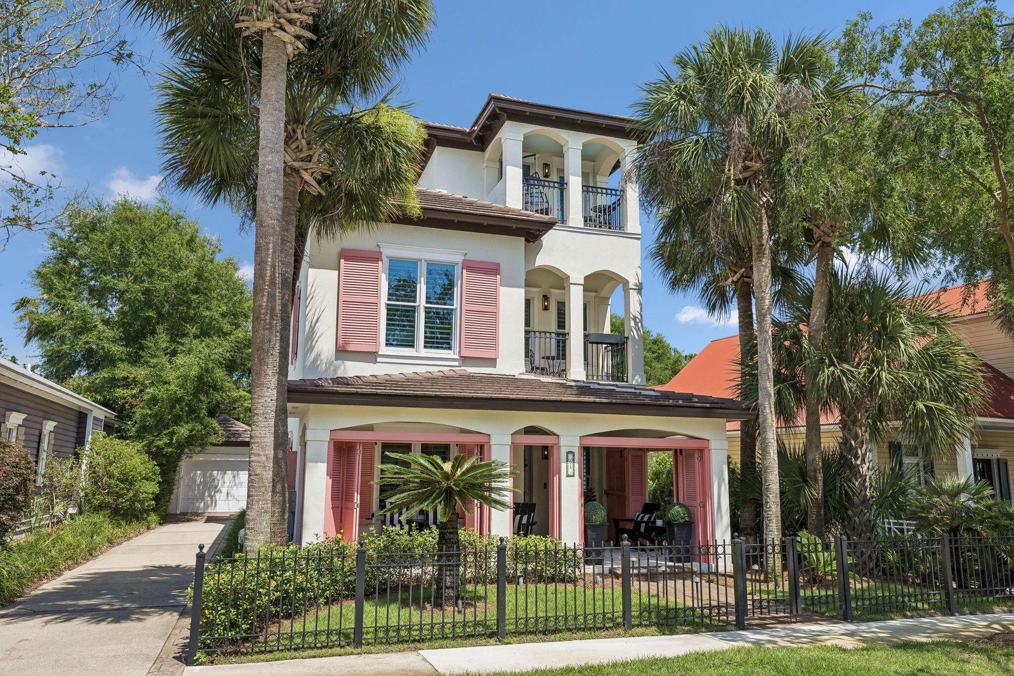 We invite you to live and play in the colorful tradition of the Neighborhood of Caribe at 61 Rue Caribe and enjoy a beautiful, exceptionally well-maintained, fully furnished 3 bedroom 3 bath home that lives like a 4 bedroom with top-floor flex space for sleeping.  Thia s ''plug in and start playing'' coastal retreat, designed for living indoors and outdoors, is ready for you to move in and boasts a concrete tile roof installed in 2024, a whole house generator, a detached garage with golf cart included, two porches, three balconies, a first floor bedroom, upgrades throughout and all hard surface flooring and thick, rich wool carpeting on the staircase.  Upon arrival through the front porch, you are greeted by a welcoming foyer which leads to the open floor plan's kitchen, dining and living room opening to a covered porch and large backyard ideal for entertaining.  The kitchen with a slide-in Jenn Air range is bright and airy with a window sink.  The living room features two sitting areas ideal for cozying up to the fireplace and a family movie night.  The primary bedroom suite enjoys its own covered balcony for evenings under the stars and a beautiful spa-like bathroom.  The primary suite walk-in closet easily accommodates two with gracious sets of built-in drawers and ample hanging space for clothes and room for accessories.  All bedrooms are ensuite and a guest bedroom, and the flex space sleeping let on to private balconies.  Caribe is a picturesque beach neighborhood tucked away on an uncrowded stretch of beach. Caribe is always beautiful, never crowded because rentals are limited to 8 occupancy. Owners enjoy tennis and pickleball courts, two pools with bath houses, lake pavilion, two beach walkovers and private, gated entry with soft evening lighting and beautiful streetscape. Live and play minutes from the area's finest golfing, tennis, dining and shopping. Explore nearby Silver Sands Premium Designer Outlet, Grand Boulevard, Market Shops at Sandestin and AMC Classic Boulevard 10. On Saturday mornings after a walk on the beach, head to the Farmer's Market at Grand Boulevard for fresh fruits, vegetables and local honey, or breakfast at the Market Shops at Sandestin. We invite you to make an appointment today to discover 61 Rue Caribe.
