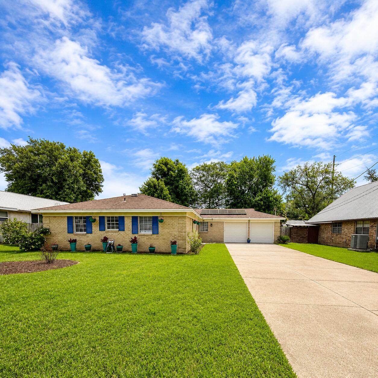 A assumable loan at 3.125% for eligible VA buyers · No HOA Beautifully updated 4-bedroom, 2-bath home features a new HVAC system and stylish upgrades throughout. Step inside to discover gorgeous new LVP flooring and a custom built-in shelving unit perfect for décor and display space. The completely remodeled kitchen offers solid surface countertops, updated cabinetry, a new sink, and  refrigerator, while a large picturesque window above the sink fills the space with natural light and overlooks the lush, private backyard. Both bathrooms have been tastefully remodeled, and all four bedrooms offer comfortable space and versatility. Enjoy outdoor living on the new deck just off the breakfast nook, surrounded by mature landscaping for added privacy. Additional features include a spacious two-car garage, oversized driveway, and a backyard designed for relaxing or entertaining. Solar panels paid at closing offers a low electric bill.