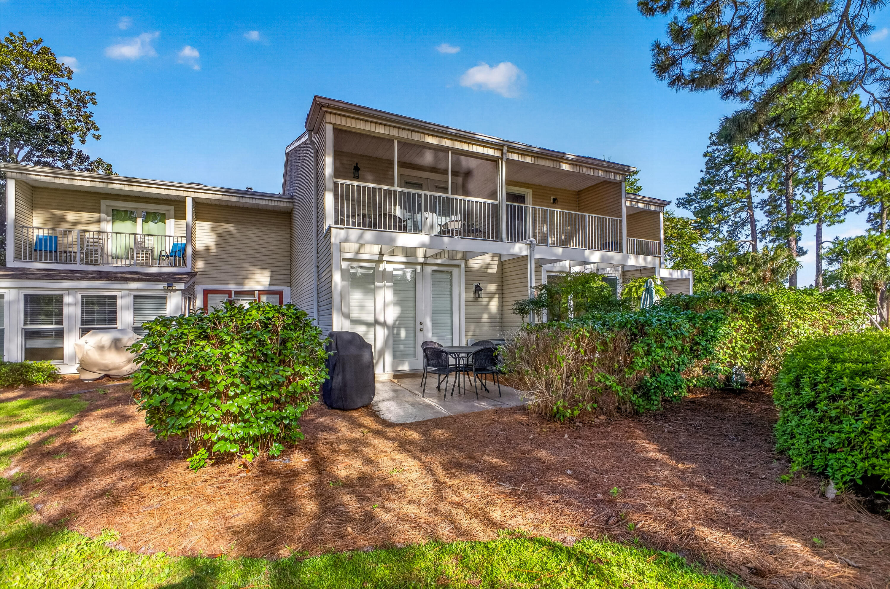 OPEN HOUSE THIS SATURDAY & SUNDAY - 10:00 - 2:00!  Beautifully updated throughout, this immaculate townhome-style condo offers an exceptional golf course setting overlooking the picturesque 12th hole of The Links Golf Course. High-end finishes include hardwood floors, crown molding throughout, stainless steel appliances, updated bathrooms, and a convenient laundry area with a full-size washer and dryer.

The spacious primary suite opens to a private screened balcony with peaceful golf course views, while the large patio provides the perfect setting for grilling, entertaining, or simply relaxing as you watch golfers finish the 12th hole. Abundant outdoor storage provides plenty of room for beach gear, bicycles, and golf equipment.

Conveniently located near the front entrance of the resort for easy access in and out, this move-in-ready home combines stylish upgrades, a prime golf course location, and the relaxed resort lifestyle buyers are looking for. Sandestin Golf and Beach Resort features more than seven miles of beaches and pristine bay front, four championship golf courses, 15 world-class tennis courts, a 226-slip marina, a fitness center, and spa. Shop, dine and play at the charming pedestrian village, The Village of Baytowne Wharf and more. Inside the gates of the resort, residents enjoy a balanced lifestyle of high-class living, spanning the 2,400 acres from the beach to the bay. Everything within the gates of the resort is accessible by golf cart or bicycle. The entire resort is interconnected by miles of pedestrian, bike and golf cart paths that weave through groves of live oaks, meandering past natural lagoons, fountains, man-made lakes, and meticulously landscaped fairways.