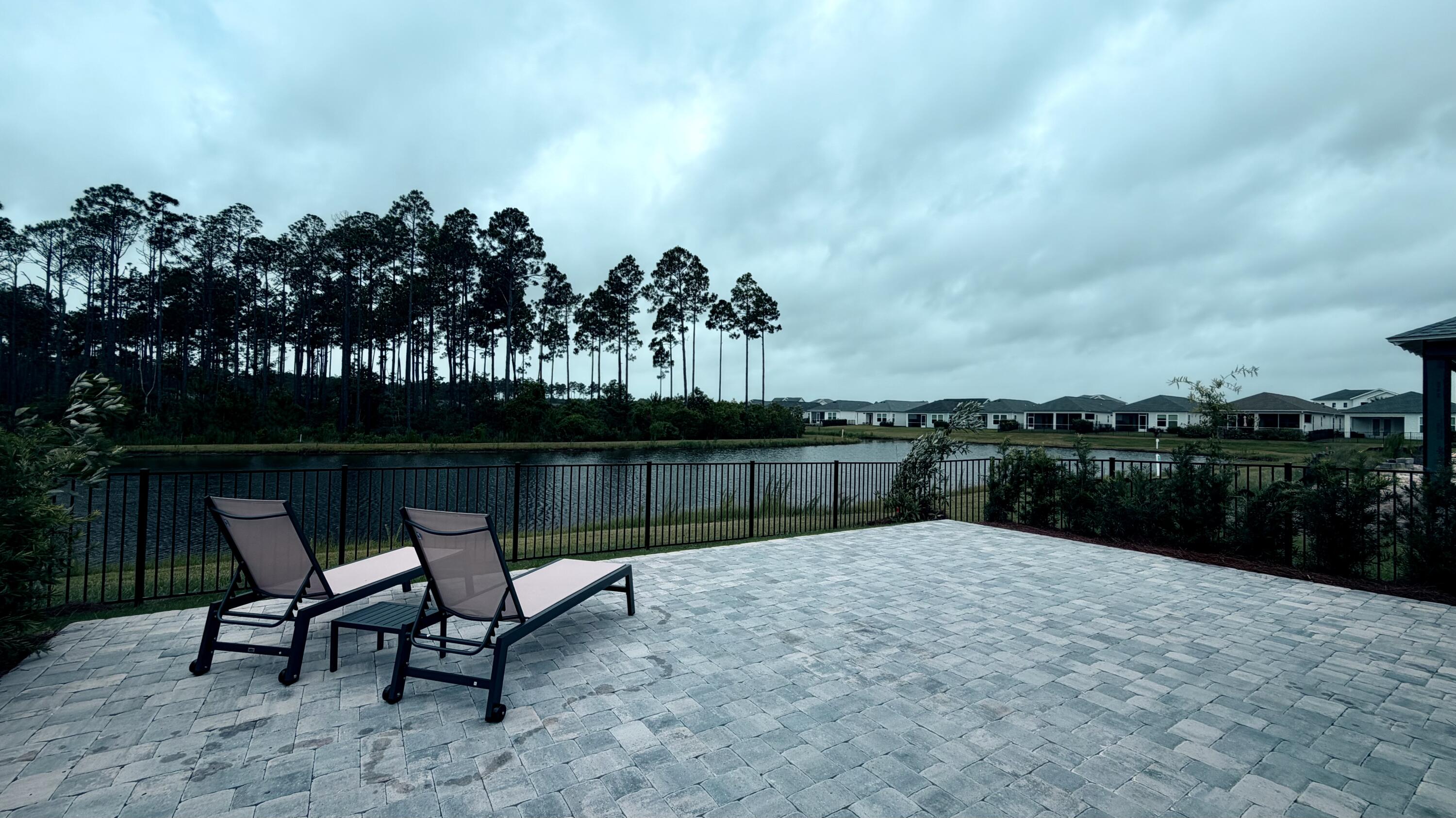 Brand-new, never-lived-in single-story home by Kolter Homes in the gated NatureWalk neighborhood of WaterSound Origins -- two miles from the beaches of Scenic 30A, in a golf-cart-friendly community. This home offers 3 bedrooms and 2 baths across 1,674 sq ft, with the den built out as a true third bedroom. Offered unfurnished and completely move-in ready, with custom window treatments, ceiling fans, and designer lighting throughout, plus two brand-new mounted flat-screen TVs, including a 79'' on the covered lanai.

*Professional photography coming soon*  

The kitchen is upgraded with a GE Café appliance package, a 36'' gas cooktop, and an upgraded range hood. Thoughtfully designed for outdoor living, the home features a very private fully fenced backyard, an extended 20' x 30' paver patio (600 sq ft), and a covered lanai with a privacy wall and motorized screen-- all overlooking a tranquil pond   preserve and sunset view. There is anHOA easment to your west increases your privacy. A two-car garage completes the home.

Keeping everything lush is effortless and worry-free: the automated, timer-based sprinkler system runs on reclaimed (non-potable) water and is covered by the owners HOA payments-- so there's no large water bill to keep the lawn and landscaping green. The owner pays all HOA dues and lawn care; the tenant pays only utilities and internet.
Resort amenities are included at no extra charge: NatureWalk's resident-exclusive Gathering Place -- beach-entry resort pool, hot tub, fitness center, tennis, and pickleball -- plus the full WaterSound Origins amenities operated by St. Joe, including unlimited golf at Origins Golf Club, an additional resort pool, tennis and pickleball, soccer,and Lake Powell access with kayaks and paddleboards.  
Move-in ready and truly turnkey -- window treatments, lighting, fans, and mounted TVs already in place, with HOA, resort amenities, and lawn care all handled. Just settle in and enjoy the 30A lifestyle, whether you're relocating to the area or living here while you build nearby.

Zoned for Dune Lakes Elementary, Emerald Coast Middle School, and South Walton High School. WaterSound Town Center's shopping and dining is a short golf-cart ride away.

Dogs are considered on a case-by-case basis and must be approved in writing. If a dog is approved, a $500 refundable pet deposit will be required before move-in.

Offered at $5,500/month as an annual (12-month) rental; six-month term considered. Easy online application with background and credit screening through RentSpree -- a quick soft credit check that does not affect your credit score.
