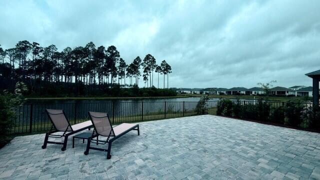 Brand-new, never-lived-in single-story home by Kolter Homes in the gated NatureWalk neighborhood of WaterSound Origins -- two miles from the beaches of Scenic 30A, in a golf-cart-friendly community. This home offers 3 bedrooms and 2 baths across 1,674 sq ft, with the den built out as a true third bedroom. Offered unfurnished and completely move-in ready, with custom window treatments, ceiling fans, and designer lighting throughout, plus two brand-new mounted flat-screen TVs, including a 79'' on the covered lanai.

*Professional photography coming soon*  

The kitchen is upgraded with a GE Café appliance package, a 36'' gas cooktop, and an upgraded range hood. Thoughtfully designed for outdoor living, the home features a very private fully fenced backyard, an extended 20' x 30' paver patio (600 sq ft), and a covered lanai with a privacy wall and motorized screen-- all overlooking a tranquil pond   preserve and sunset view. There is anHOA easment to your west increases your privacy. A two-car garage completes the home.

Keeping everything lush is effortless and worry-free: the automated, timer-based sprinkler system runs on reclaimed (non-potable) water and is covered by the owners HOA payments-- so there's no large water bill to keep the lawn and landscaping green. The owner pays all HOA dues and lawn care; the tenant pays only utilities and internet.
Resort amenities are included at no extra charge: NatureWalk's resident-exclusive Gathering Place -- beach-entry resort pool, hot tub, fitness center, tennis, and pickleball -- plus the full WaterSound Origins amenities operated by St. Joe, including unlimited golf at Origins Golf Club, an additional resort pool, tennis and pickleball, soccer,and Lake Powell access with kayaks and paddleboards.  
Move-in ready and truly turnkey -- window treatments, lighting, fans, and mounted TVs already in place, with HOA, resort amenities, and lawn care all handled. Just settle in and enjoy the 30A lifestyle, whether you're relocating to the area or living here while you build nearby.

Zoned for Dune Lakes Elementary, Emerald Coast Middle School, and South Walton High School. WaterSound Town Center's shopping and dining is a short golf-cart ride away.

Dogs are considered on a case-by-case basis and must be approved in writing. If a dog is approved, a $500 refundable pet deposit will be required before move-in.

Offered at $5,500/month as an annual (12-month) rental; six-month term considered. Easy online application with background and credit screening through RentSpree -- a quick soft credit check that does not affect your credit score.