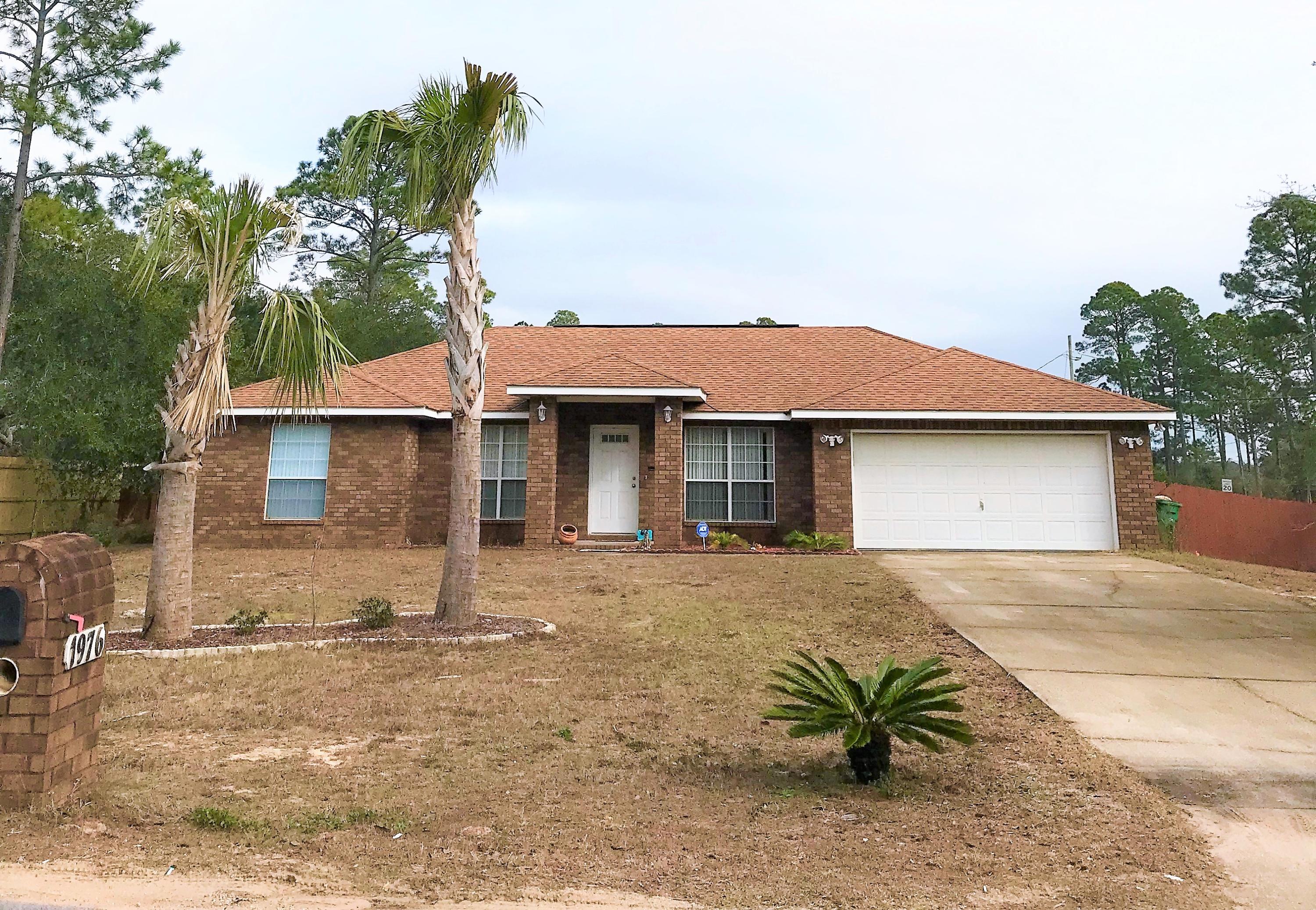 SELLER TO PAY SOME CLOSING COST. TRANSFERRABLE HOME WARRANTY.
This beautiful 1924 square foot home is all-brick with a split floor plan, 3 bedrooms, 2 baths and a bonus room. It sits on a large, fenced in corner lot located in the heart of Navarre - Just minutes away from schools, beaches, bases and shopping! The large kitchen has maple wood cabinets and a double oven. There is a breakfast nook, pantry, lots of cabinet and counter space. The Great Room has a vaulted ceiling and plant ledges. The huge 20x13 master bedroom has a trayed ceiling and master bath featuring separate shower, garden tub, and a large walk-in closet. A new A/C was just installed on 10/24/2017. The wooden playset in the backyard conveys. A brick mailbox, dimensional shingles and decorative brickwork highlight the exterior of this must see hom