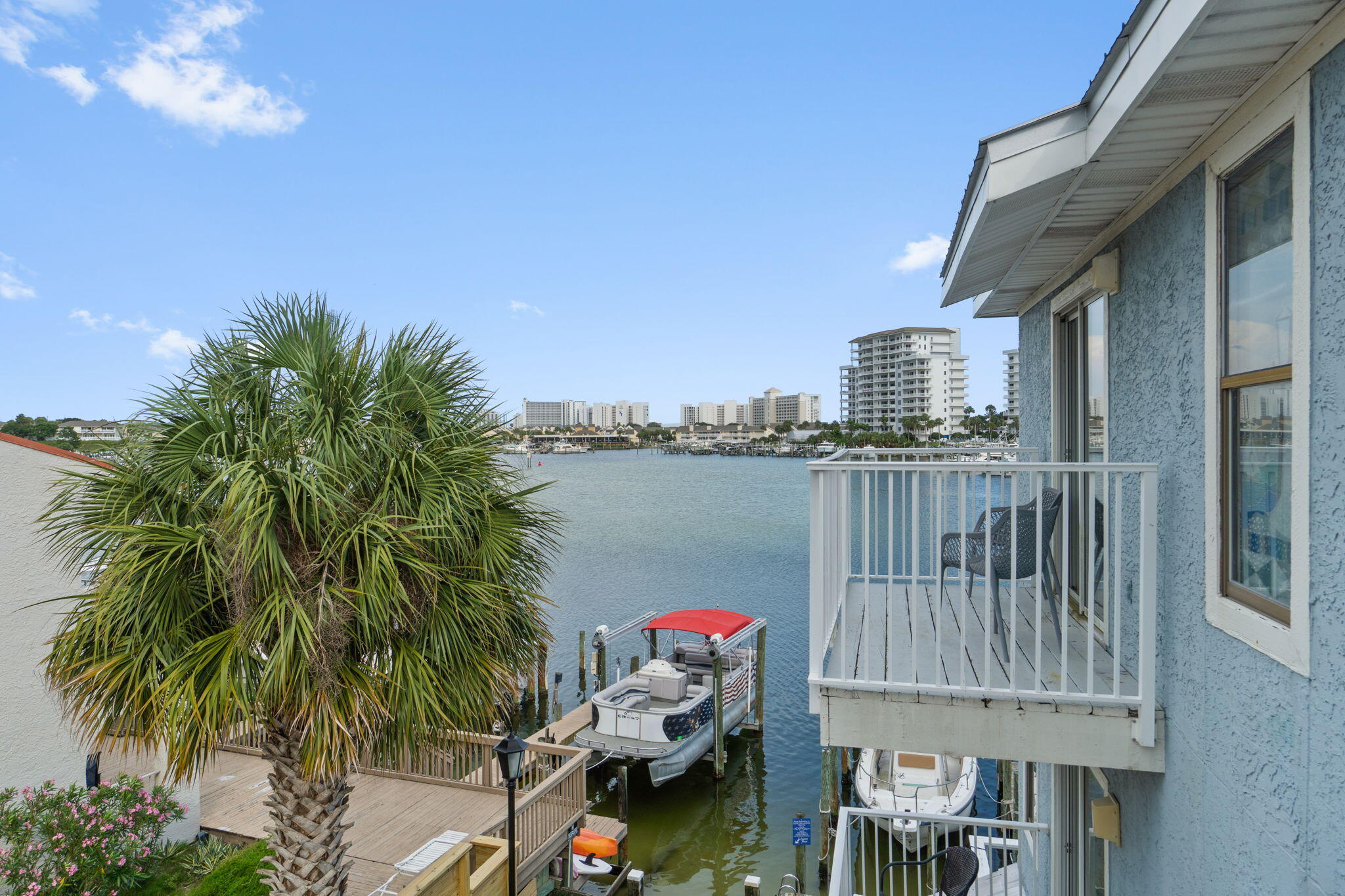 ENJOY DESTIN HARBOR FRONT LIVING where you can Rent a boat slip right outside your door for only $75/month!  The community's GATED/DEEDED beach access is only a short block away!!  You get it all with this FULLY FURNISHED TURNKEY super affordable condo!  Feel like you're almost sitting on top of the water as you enjoy the beautiful harbor views from your two balconies!  Take your own boat or the Destin Water Taxi to restaurants, dining and shopping  along the harbor and Crab Island is only a dolphin's jump away!   Whether you choose to use as your primary residence or as a short term rental money making machine, this location can't be beat!   Two ensuite bedrooms provide the ultimate in privacy and the fully equipped and renovated kitchen has everything you need.  The converted garage is climate controlled and has tons of space for storage, dedicated areas to use for laundry, games, and a separate sleeping area with 2 sets of bunks featuring full beds on the bottom and twins on the top!  There's plenty of room for everyone!  With a dedicated parking space in addition to the converted garage, you can decide whether to park in or out.  If you're looking for a more intimate smaller community with 16 units total right on the harbor, this is it!!  Super close to all the activity when you want it and a quiet space to retreat to when you're ready to relax!  Call Today for an appointment to See!!