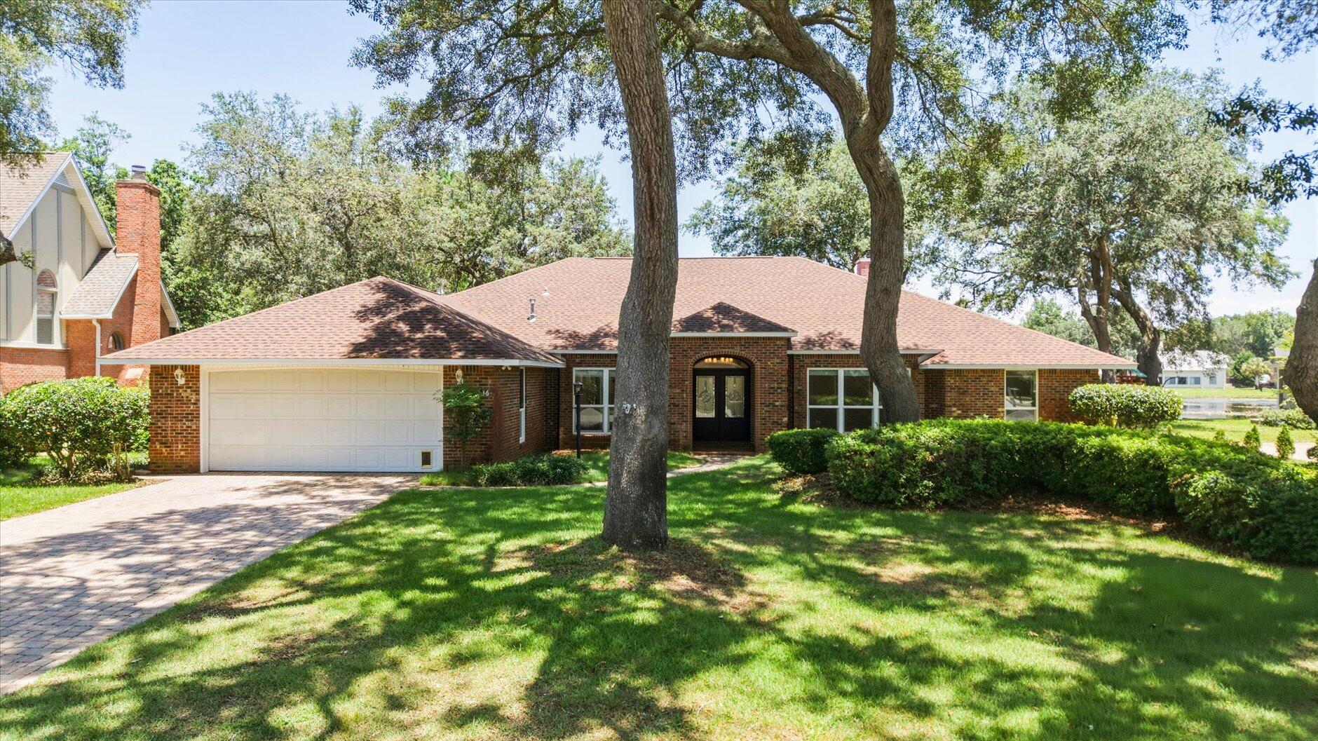 Absolutely stunning waterfront home in the highly desirable gated Windward community of Bluewater Bay! Situated on a premium lot with 100 feet of Lido Lake frontage, this beautiful 4-sided brick home offers breathtaking water views from a spacious open floorplan highlighted by a dramatic wall of windows.

Designed for both everyday living and entertaining, the home features a spectacular sunroom complete with a wet bar, wine fridge, ice maker, and additional TV area for game days. Step outside to the expansive deck overlooking the lake and enjoy Florida living at its finest.

This single-story, wheelchair-accessible home offers 4 bedrooms PLUS office, 3 full baths, an oversized 2-car garage, and gorgeous hardwood and tile flooring throughout--no carpet anywhere. Recent updates include a new roof, hurricane-impact windows, and newer kitchen appliances. Natural gas services the range, water heater, and outdoor grill connection.

Enjoy an unbeatable location just minutes from the Mid-Bay Bridge, providing quick access to Destin Commons, shopping, dining, and beaches while avoiding Highway 98 traffic.

Windward residents enjoy exceptional amenities including a gated entrance, tennis club, four swimming pools, pickleball courts, marina with waterfront restaurant and bar, golf course, and convenient boat and RV storage.

A rare opportunity to own a move-in-ready waterfront home in one of Niceville's most sought-after communities!
