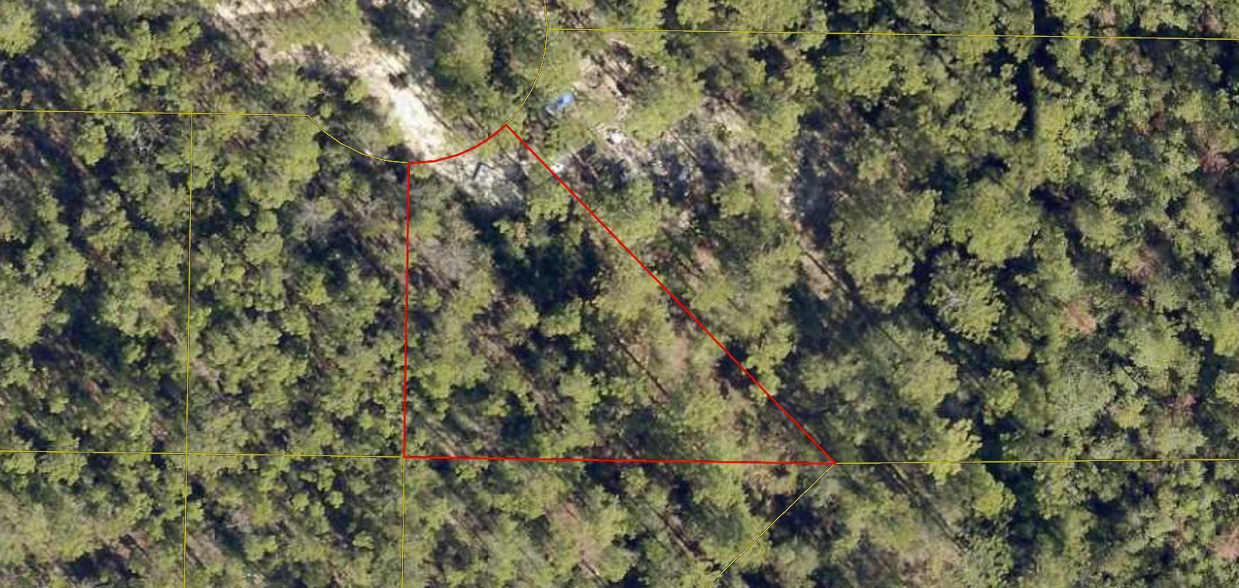Wooded 0.307-acre vacant lot located in the Oakwood Hills Subdivision of DeFuniak Springs. This parcel offers an opportunity for residential development in an established subdivision with convenient access to Interstate 10, local schools, shopping, and surrounding communities. Please refer to the recorded subdivision map located in the Documents section for the approximate lot location. Buyer will be responsible for obtaining a survey to identify property corners and verify lot boundaries. Buyer to verify all measurements, zoning, land use, utilities, flood zone, and building requirements during their due diligence.