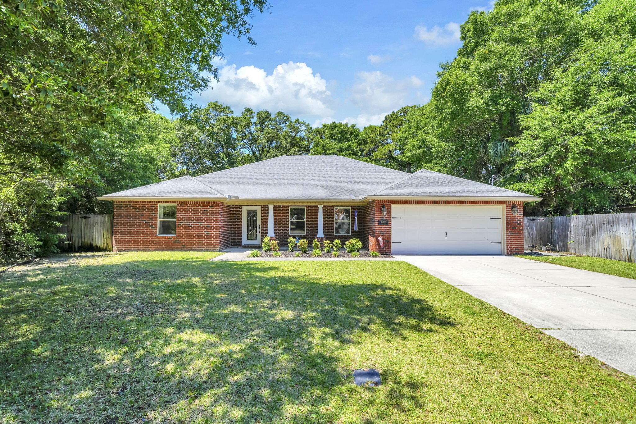 ... a dual vanity and shower/tub combo. As you make your way to the back yard, you'll enjoy the extended covered patio, additional decking, outdoor shower, and a backyard that offers an abundance of room for entertainment as well as privacy. This property is a fantastic location with easy access to Eglin AFB or the beach. Call for a showing today!