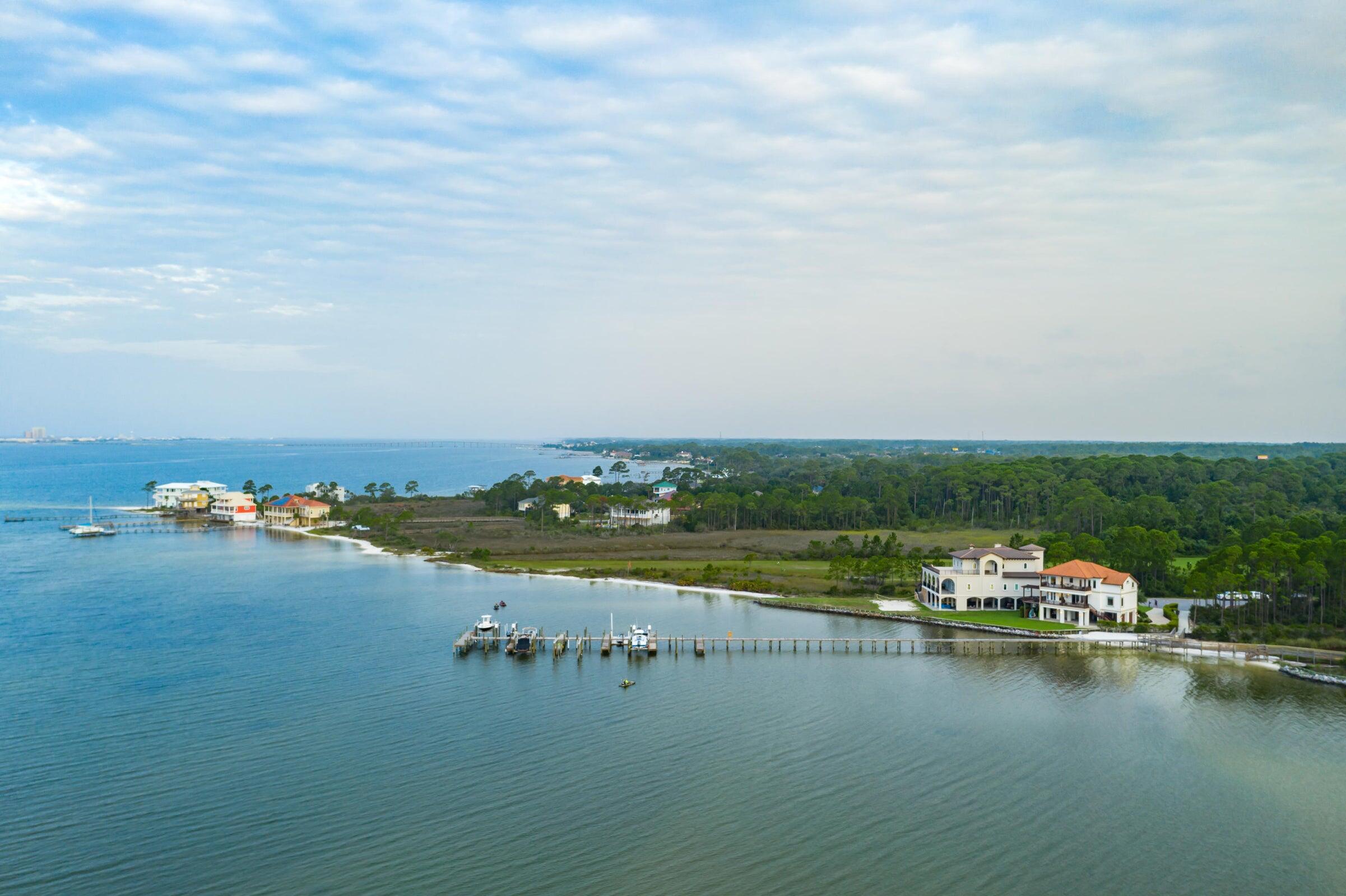 Welcome to the desirable gated community of Palmetto Preserve--home to one of the last remaining waterfront lots in Navarre.

This exceptional property offers pristine water clarity, deeded beach access, and a private boat slip--a rare privilege, as not every home in the community has one. Build your dream home and enjoy immediate access to the water from day one.

Located in East Navarre, Palmetto Lake Preserve is conveniently close to top-rated schools, shopping, and Hurlburt Field Air Force Base, while still offering privacy and tranquility. The low HOA of just $115/month truly delivers value, covering a beautiful gated entrance, underground utilities, well-lit paved roads, a community dock, and meticulously maintained beach access. The lot features approximately 165 feet of total water frontage and spans .39 acres, providing ample space for a luxury custom home. A Geo-Con soil study has already been completed, allowing your builder to review and move forward without delay. In addition, the seller is providing a survey at their expense, along with a potential building floor plan that may be used or customizedvaluable tools to help bring your vision to life.

Nestled in a quiet cul-de-sac, the community is thoughtfully designed with a Y-shaped entrance leading to two cul-de-sacs, creating minimal traffic and a peaceful setting. With only two neighboring waterfront homes, you'll enjoy exceptional privacy.

Spend your days dolphin watching, boating, kayaking, fishing, and soaking up the Florida sunjust minutes from Navarre Beach.

All showings must be accompanied by a REALTOR® due to gated access.

This is truly one of the finest buildable waterfront lots remaining in Navarrea rare opportunity to secure luxury, lifestyle, and long-term value.
