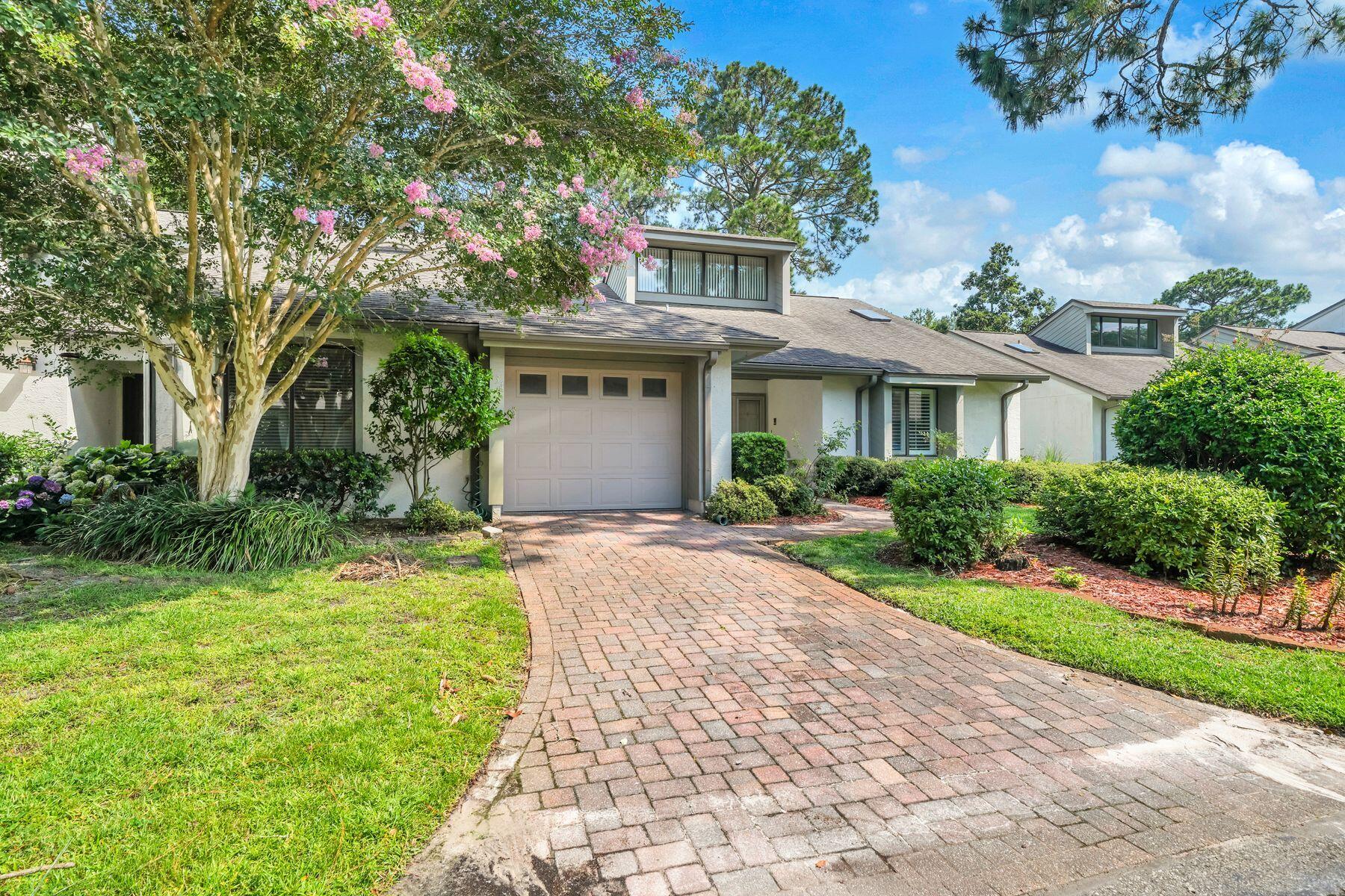 This charming two-bedroom, two-bathroom, single-level home features a functional and spacious floor plan, offering a contemporary feel with vaulted ceilings and abundant natural light throughout. Perfect for entertaining, the home is located on the 2nd hole of the Bay Golf Course. It includes a large living room with a stone fireplace, a formal dining room, an informal dining area off the ample kitchen (which features new stainless appliances), and a separate sunroom overlooking the golf course. The property also includes a single-car garage and is well-situated within the Gleneagles community. Bluewater Bay offers resort-style amenities, including swimming pools, a tennis center, pickleball courts, walking trails, and access to golfing, sailing, yachting, fishing, and other water sports. It is within walking distance to the Blue Tee Restaurant and near the LJ Schooners Dockside Restaurant & Oyster Bar. Additionally, it is conveniently located close to hospitals, shopping, and local activities, and is just 12 minutes away from the beautiful white sand beaches of Crystal Beach in Destin, Florida.