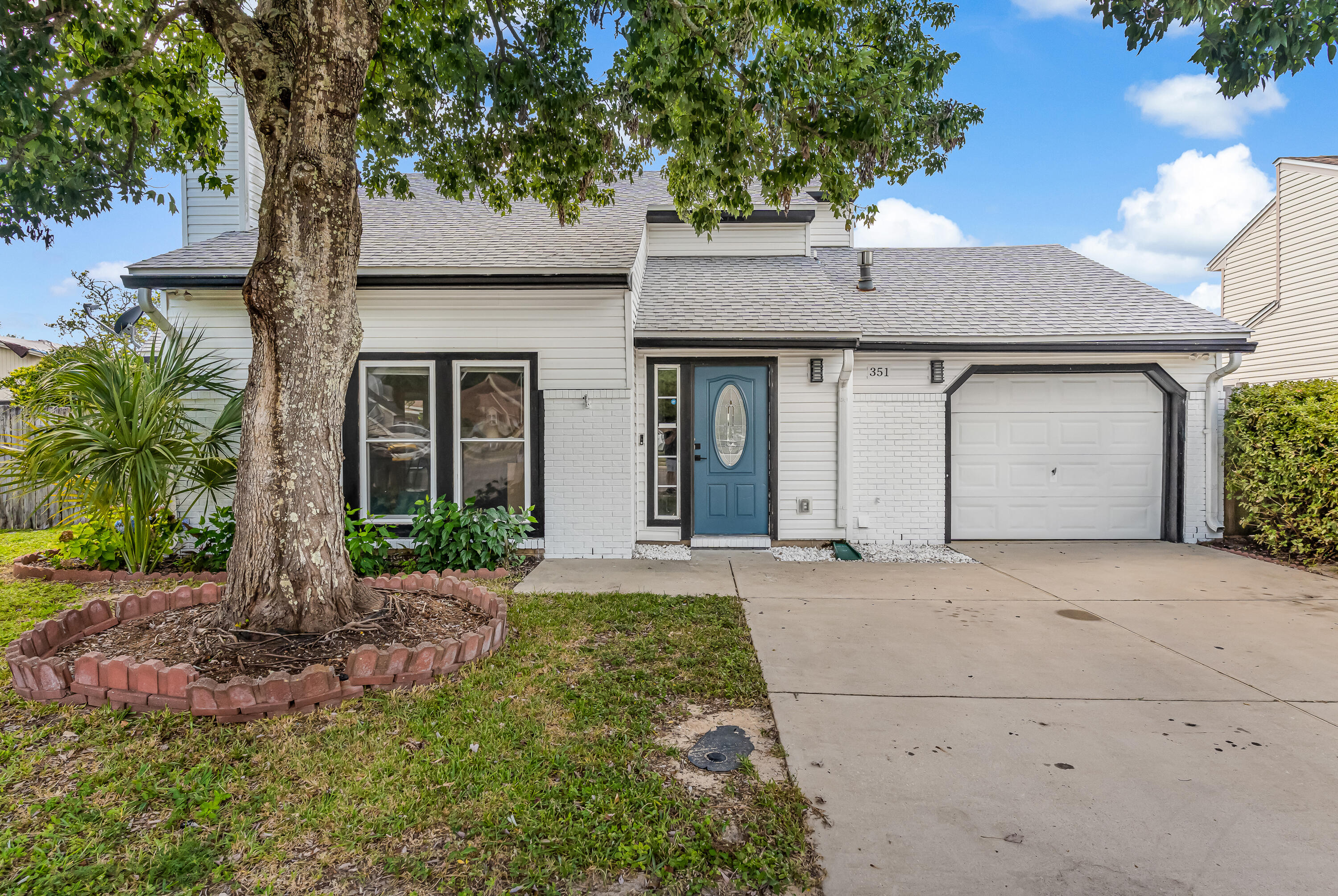 As you step through the front door of this charming 4BR/2BA home, you will notice the high ceilings & large windows bringing in natural light that draw you into the main living space with an open floor plan. The living room flows right into the updated kitchen. The kitchen has ample storage & counter space and a breakfast bar. The dining area features great wall to wall built in cabinetry for additional storage. You walk through double doors off the front of the home into the primary bedroom. It has ample closet space & an ensuite bathroom. There is another bedroom downstairs & two bedrooms upstairs, one with a walk in closet. There is a bathroom located upstairs & is fully updated. The backyard features a spacious screened in porch, shed & green space. Roof- 2023 HVAC-2022 HWH- 2023