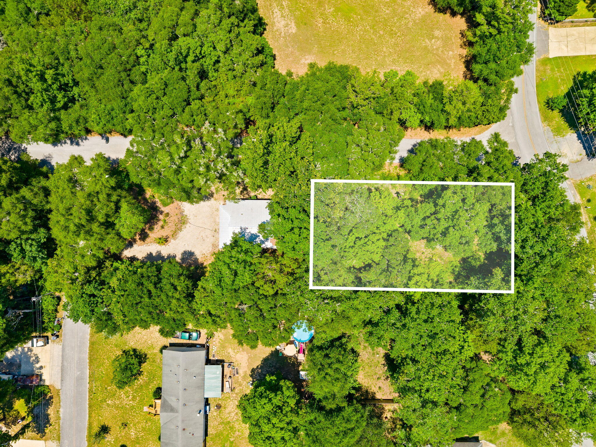 Lot 13 North Ave. Freeport is the perfect location for your new home. This 75x 150 lot nestled among mature trees blends country tranquility with the irresistible allure of waterfront proximity. The bay is just moments away and the serene country setting provides a peaceful retreat for your future home. It is only a short walk to the Choctaw Beach Park, with a boat launch. It is perfect for picnics, fishing, and stunning Choctawhatchee Bay views. The Choctaw Beach neighborhood is a hidden gem in the Florida Panhandle. This area offers exceptional value with convenient proximity to the beaches and attractions of the Emerald Coast. The adjacent lot 14 with home next-door may also be purchased if interested.