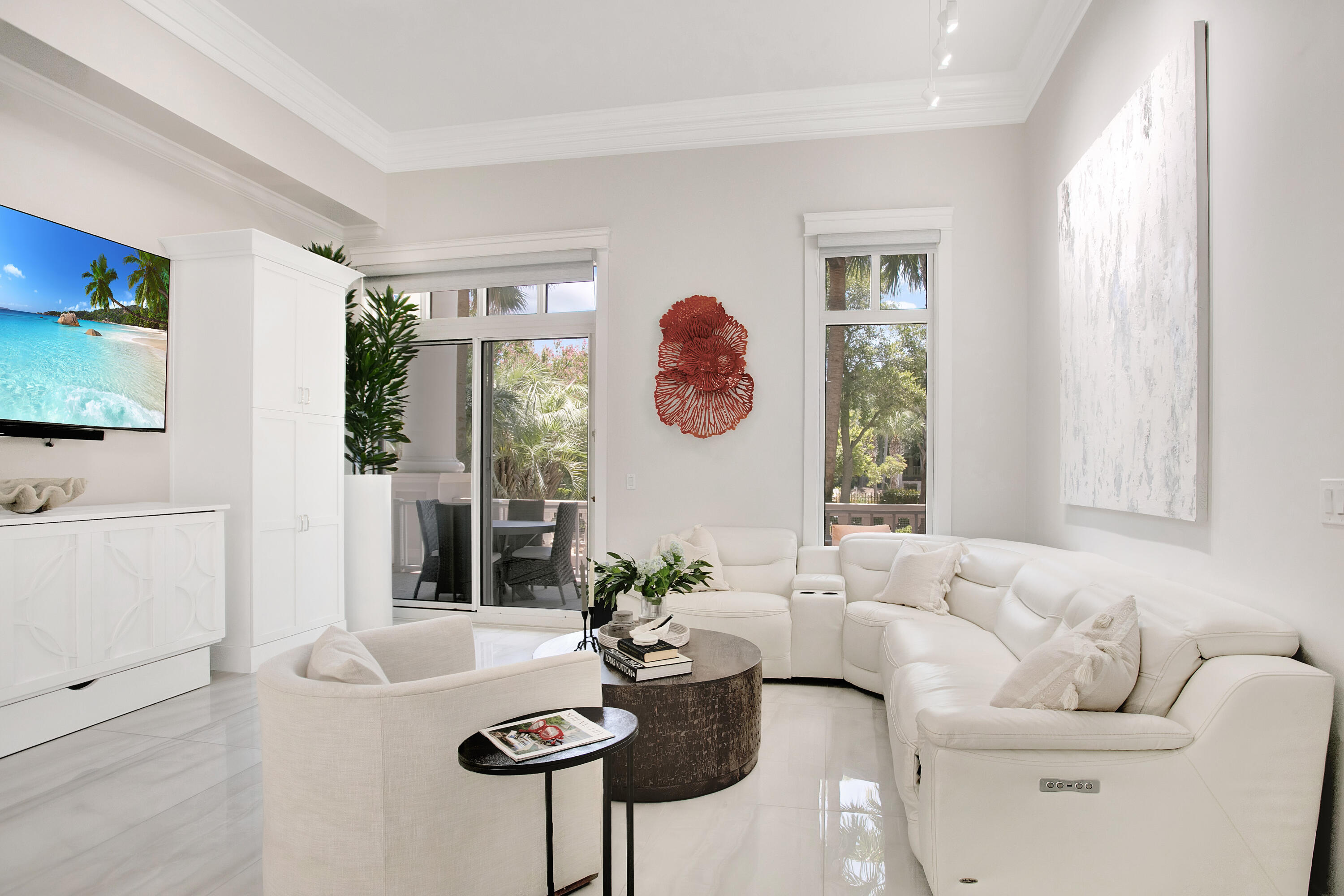 Impeccable Style & Custom Luxury in Grand Sandestin. This completely renovated residence in the Grand Sandestin showcases meticulous craftsmanship and elevated design, offering one of the most impressive & unique condominiums in the building. As a ground-floor unit, it provides effortless access and added convenience—no elevators required. Step inside to discover soaring 13.4' ceilings, 24'' x 48'' polished onyx white porcelain flooring, custom LED lighting throughout (all on dimmers), and textured wall tile that adds depth and dimension. The living space is enhanced with built-ins, including roll out drawers, shelves, computer workspace and soft close doors. Enjoy premium sound system (soundbar, subwoofer, & two small speakers), and custom furnishings including a 65'' and 85'' TV. The gourmet kitchen features stainless steel appliances, quartz countertops, under-cabinet and under-counter lighting, wine cooler and a sleek breakfast bar with seating for four.

The spacious primary suite includes two Serena & Lily Driftway 3-drawer nightstands in Coastal Blue, and remote-control window treatments. Both spa-inspired baths boast frameless glass walk-in showers, quartz counters, and lighted mirror vanities.

A queen-size Murphy bed tucked beneath the custom media hutch offers sleeping space for up to four guests. Additional upgrades include a new LG washer & dryer, Halo water detection system, new Cox Fiber, and installed automatic charging for electric blinds.

Enjoy your private outdoor space with a custom rug, new matching lounge chair, and take advantage of the 2 owner's closet and storage cage. Grand Sandestin owners have exclusive access to a resort-style pool, spa, kiddie pool, grilling area, and fitness center.

Exclusion: White Bedroom Chest, Outdoor Concrete Table and Chairs, White swivel chair, personal belongings, items in storage cage, computer, monitors and printers.

As an introduction to the Sandestin lifestyle, we invite our new owners to explore amenities that make Sandestin special. The listing brokerage and seller(s) are presenting the buyer(s) of this property with (2) 90-minute rounds of Tennis court time, a golf foursome at one of our three championship courses, and a round of golf for up to four (4) players at the unrivaled Burnt Pine Golf Club.

Sandestin Golf and Beach Resort features more than seven miles of beaches and pristine bay front, four championship golf courses, 15 world-class tennis courts, a 226-slip marina, a fitness center, spa and celebrity chef dining. Shop, dine and play at the charming pedestrian village, The Village of Baytowne Wharf and more. Inside the gates of the resort, residents enjoy a balanced lifestyle of high-class living, spanning the 2,400 acres from the beach to the bay. Everything within the gates of the resort is accessible by golf cart or bicycle. The entire resort is interconnected by miles of pedestrian, bike and golf cart paths that weave through groves of live oaks, meandering past natural lagoons, fountains, man-made lakes, and meticulously landscaped fairways.