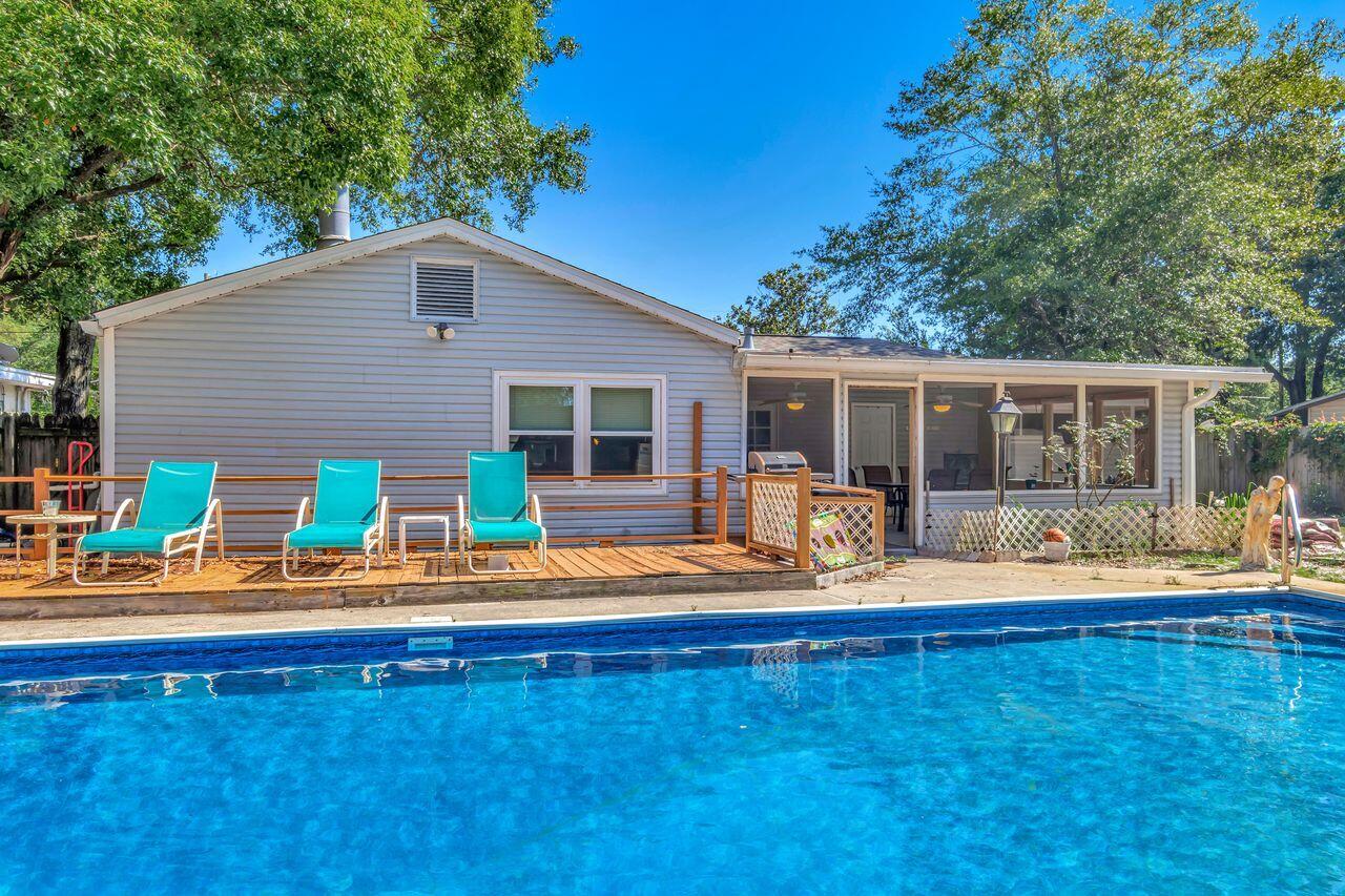 Pool Party at Your House? Introducing an incredible opportunity for an affordable pool home in Fort Walton Beach! This charming 3-bedroom, 1.5-bathroom residence is nestled on an almost 1/4 acre lot. Boasting a traditional ranch-style layout, this home is brimming with potential. The interior features a welcoming front living room, a well-appointed kitchen, a separate dining room, a spacious den, and a versatile bonus room. The bedrooms and bathrooms are conveniently connected through a central hall, with the full bath offering access to the expansive screened porch. The den showcases a stunning stone fireplace and provides access to the back porch, while the bonus room has its own private entrance.