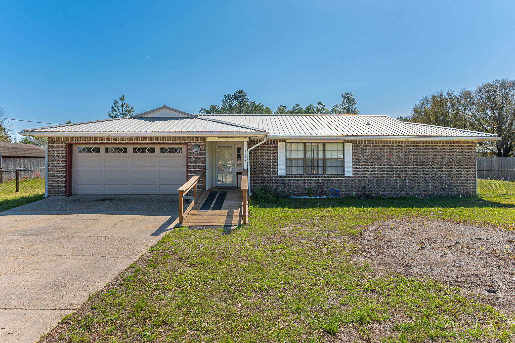 This beautiful 3-bedroom, 2-bath home offers comfort, space, and flexibility perfect for anyone looking for a place to truly call home. Inside, you'll find a welcoming layout with plenty of natural light and room to relax or entertain. Step outside to enjoy the large, fully fenced backyard, perfect for  weekend gatherings. The screened-in patio is perfect for cookouts, morning coffee, or unwinding in the evenings. For added convenience, the home can be offered furnished or unfurnished to fit your needs. Don't miss this wonderful rental opportunity!
