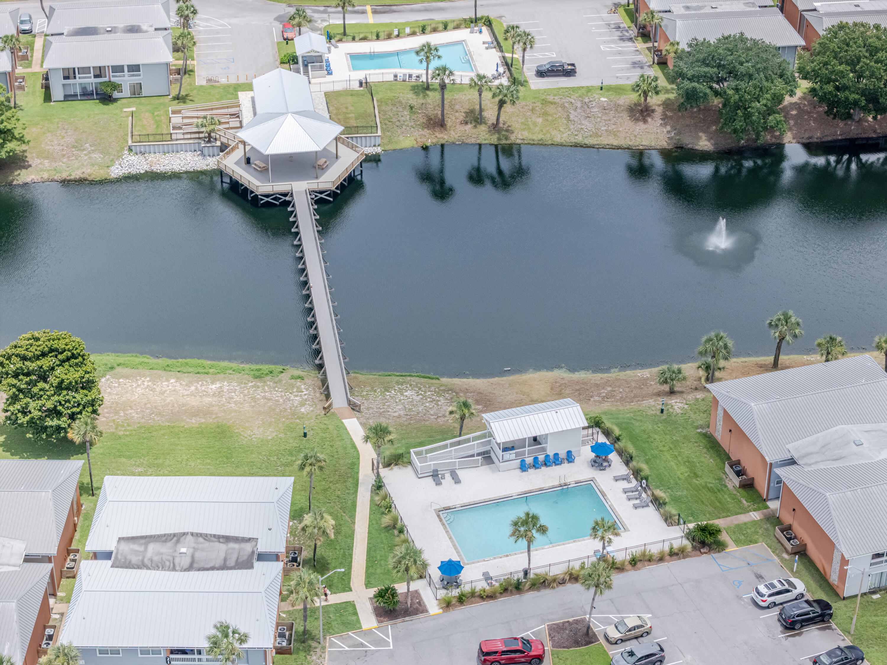 Rare Find 2 Bedrooms 2 Bathrooms (full size) + Laundry Room. Gulf Terrace Condominium 0.8 miles to public beach access. Remodeled, Clean and Spacious! Both Tourists & Locals Love the Convenient Location. Short Term rentals Allowed, Active Airbnb! Furniture included. Community Features: Free Parking, Gated Entrances from HWY 98 and Airport Rd, Access to 3 swimming pools, Tennis/Pickleball court, Dog Park, EV chargers, maintained green areas, picnic tables & a lake. HOA Coverage: building insurance and exterior maintenance, water, internet, sewer, trash, landscaping, and maintenance of pools and gates. Owner pays Electric Only. Active Airbnb & Gated Community contact agent for showing schedule and access instructions.
