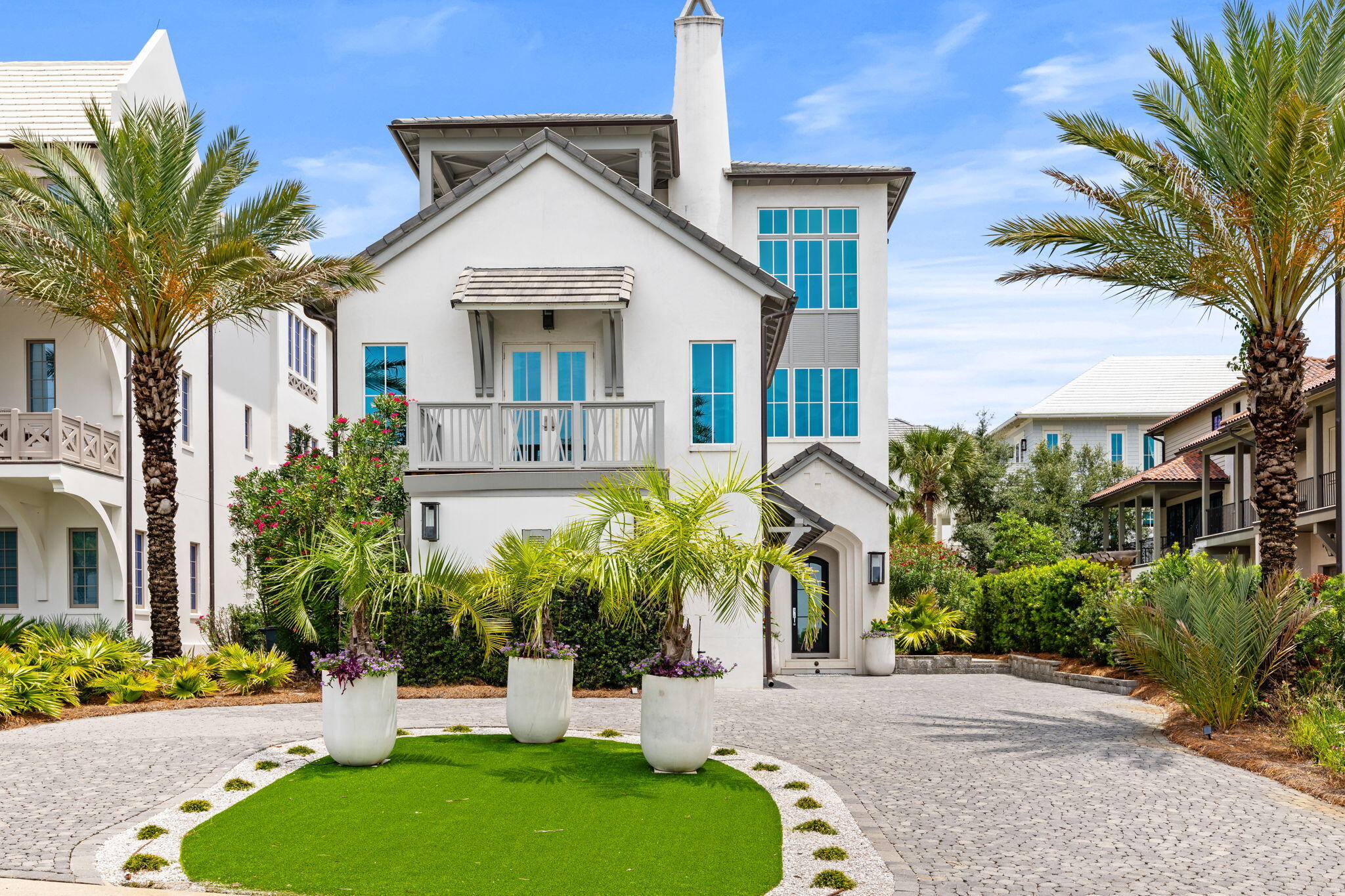 Set within the gated community of Paradise by the Sea, this Gulf-view residence pairs generous scale with one of the most desirable ownership experiences along Scenic Highway 30A, including private beach access and a low-density coastal setting.

Spanning 7,669 square feet, the seven-bedroom, eight-bath home is thoughtfully arranged across three levels with a reverse floor plan designed to capture sweeping views of the Gulf. The upper level serves as the heart of the home, where expansive living and dining spaces, a chef's kitchen, and the primary suite are framed by natural light and coastal vistas.

An elevator connects all levels, while a concrete exterior provides lasting durability. The home's extensive amenity package includes multiple guest suites, a home theater, fitness room with sauna, wet bar, and a variety of gathering spaces designed for both entertaining and everyday living.

Outdoor living centers around a private pool and spacious lounge areas, creating a seamless connection between indoor comfort and the coastal environment beyond.

Paradise by the Sea is one of the few gated communities along 30A offering private beach access, with a limited collection of homes positioned between Alys Beach and Rosemary Beach. Residents enjoy convenient access to celebrated dining, shopping, and recreation while returning to a quieter stretch of the coast. Combining Gulf views, substantial living space, private beach access, and an impressive array of amenities, this residence offers a distinctive opportunity within one of 30A's most established beachfront communities.