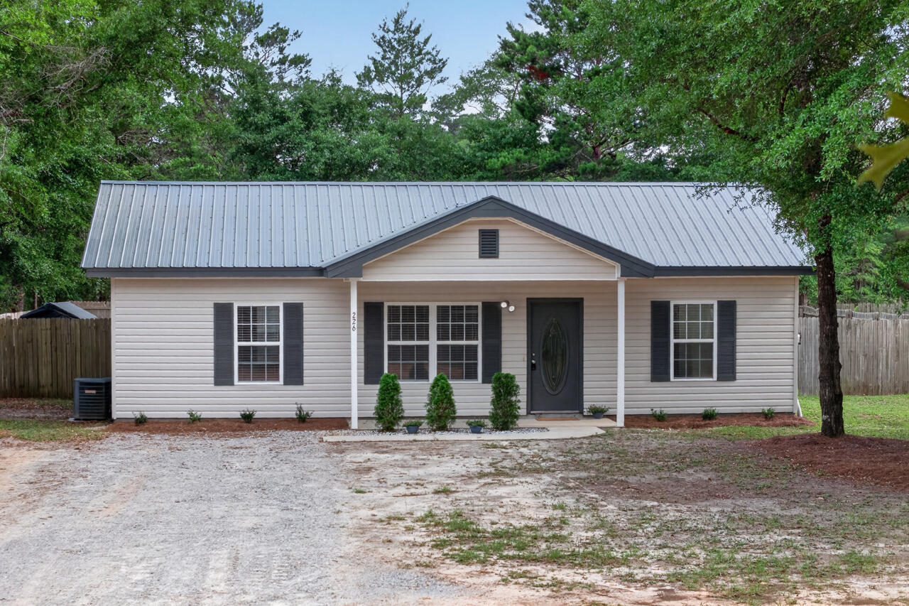 Country Living Without Giving Up Convenience

What if you could enjoy the peace and privacy of country living while still being within easy reach of work, shopping, dining, healthcare, entertainment, and some of Florida's most beautiful beaches?

Nestled just outside DeFuniak Springs, this inviting 3-bedroom, 2-bath home offers the lifestyle many buyers are searching for but rarely find--a place where you can slow down, spread out, and enjoy your own space without sacrificing convenience.

From the moment you arrive, you'll appreciate the freedom this property provides. With no HOA, a fully privacy-fenced backyard, and a desirable Flood Zone X location, you'll have the flexibility to create the lifestyle you've always envisioned. Whether that means gardening, raising chickens, entertaining family and friends, or simply relaxing with a cup of coffee on the front porch, this property offers room to make it your own.

Inside, the thoughtfully designed split-bedroom floor plan provides both comfort and functionality. Durable vinyl plank flooring runs throughout the home, while the attractive galley-style kitchen features stainless steel appliances, stylish countertops, a tiled backsplash, and freshly painted walls and baseboards that create a bright, welcoming atmosphere. A convenient utility room with washer and dryer hookups completes the home's practical design.

One of the most appealing aspects of this property is the value it offers in today's market. Many buyers are searching for a home that doesn't require costly renovations, major repairs, or ongoing HOA fees. Here, much of the work has already been done. The home is clean, well-maintained, and move-in ready, allowing you to spend less time on projects and more time enjoying your new home. Finding a property that combines privacy, functionality, and affordability in such a convenient location is becoming increasingly difficult.

Beyond the property itself is where this location truly shines. Enjoy the tranquility of rural living while remaining just minutes from shopping, restaurants, schools, healthcare, and everyday conveniences in DeFuniak Springs. For those who commute, US-90 provides easy access throughout the region.

When it's time for recreation, some of Northwest Florida's most sought-after destinations are within reach. Spend weekends exploring the sugar-white beaches of the Emerald Coast, enjoying the coastal communities of 30A and Santa Rosa Beach, boating around Crab Island, or experiencing the dining, shopping, and entertainment options found throughout Destin and Panama City Beach.

The location is also ideal for military personnel, healthcare professionals, and those seeking access to major employment centers, with convenient proximity to Eglin Air Force Base, Duke Field, Hurlburt Field, Sacred Heart Hospital, regional airports, and surrounding communities.

Whether you're searching for your first home, a place to downsize, an investment opportunity, or simply a property that offers more freedom, privacy, and flexibility, this home delivers a rare combination of country charm, move-in-ready convenience, and exceptional value.

Come experience the space, tranquility, and lifestyle you've been looking for.

Systems info:
New Interior paint 2026
New Roof 2021
New windows 2022
New heat pump 2017