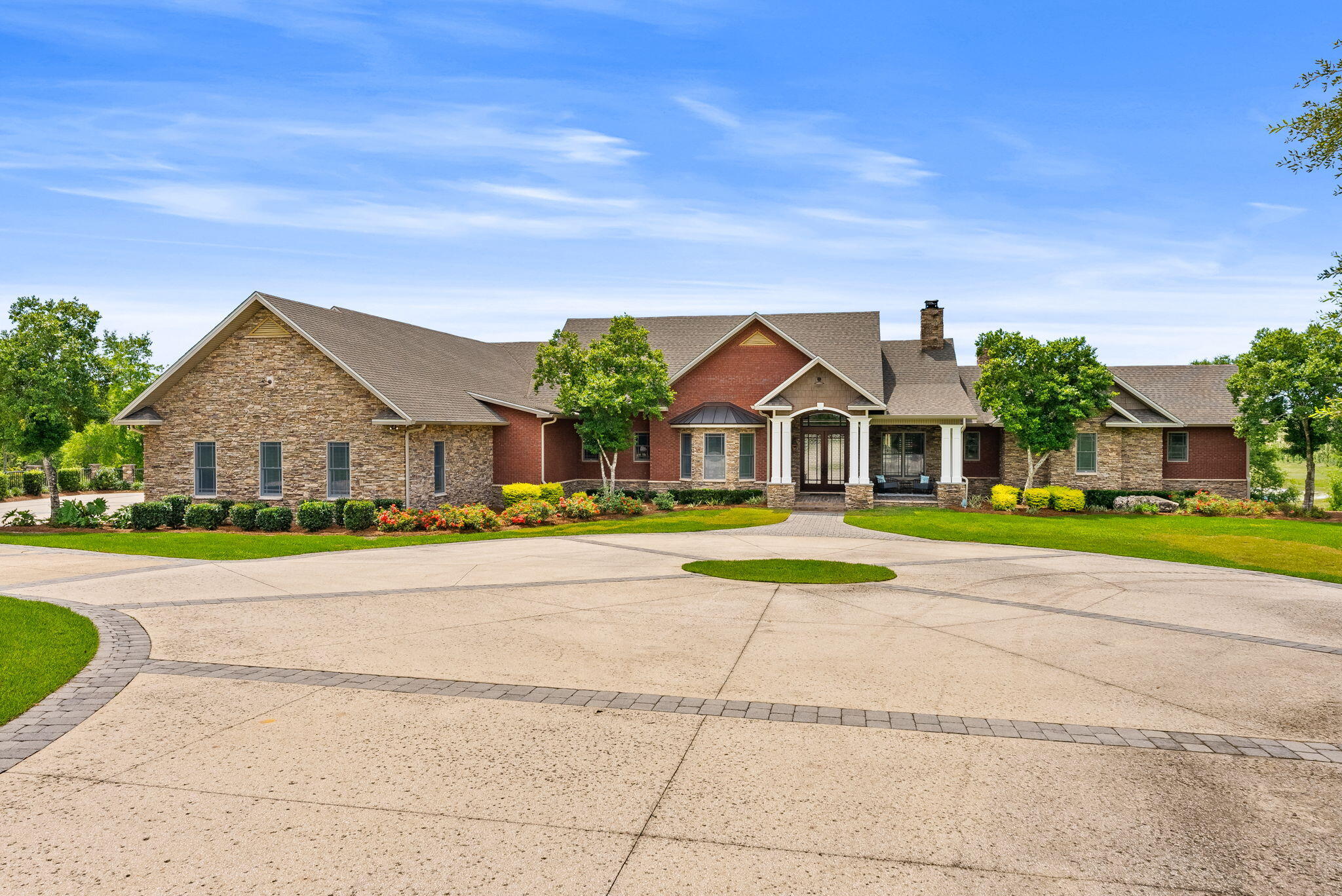 Rare Offering: 180-Acre Private Estate | Equestrian Friendly | Owner Financing Available
Welcome to 2601 Highway 20 E, a once-in-a-lifetime opportunity to own a breathtaking private estate in Panama City, Florida. Equestrian friendly and set behind a grand 14-foot private gate surrounded by over 185 acres, a 60 x 100 outdoor building (6,000 square feet), 7-stall barn with tack room and bathroom, all new planted pines in 2023, and a private spring-fed lake, this custom-built home offers the perfect balance of luxury, functionality, and country living.
Built in 2007 by renowned builder Rita Jones, with quality and craftsmanship at its core, this expansive 6-bedroom, 6 full bath, 2 half bath estate boasts over 7,351 square feet of heated and cooled living space. From the moment you step inside, you are welcomed by soaring vaulted ceilings, large open spaces, and refinished hardwood floors. Thoughtfully designed finishes are found throughout. The first floor is constructed with solid concrete block for strength and longevity, while the second floor features durable 2x6 framing for added efficiency and durability.
The spacious primary suite is a true retreat, featuring his and her closets, a spa-like bath with custom tile shower, heated floors in mathroom, and a Toto toilet. Peaceful views of the surrounding property complete the experience. Entertain with ease in the formal dining room or game room, host unforgettable gatherings around the outdoor kitchen, or retreat to the cozy study for a quiet evening. The gourmet kitchen and luxurious living areas flow seamlessly to the outdoors, where a zero-entry saltwater pool, lush landscaping, and breathtaking lake views await.
The home is equipped with a Control 4 Smart Home system, spray foam insulation in the walls and ceilings, Andersen storm doors and windows, and four HVAC units for maximum energy efficiency. For convenience and peace of mind, the property features two 200-amp electrical panels, two deep wells, two septic systems, and a 40KW whole-house generator powered by a dedicated 500-gallon propane tank, with a separate 500-gallon propane tank serving the home.
The estate also includes a three-car garage with insulated 12' x 10' doors, offering plenty of space for vehicles, recreational toys, or additional storage. At the heart of the property lies a serene spring-fed lake teeming with bass, bream, and catfish -- the perfect backdrop for fishing, paddling, or simply relaxing in the beauty of nature.
This is more than a home -- it's a lifestyle. A place where wide-open spaces meet modern comforts, where equestrian dreams come to life, and where every day feels like a retreat. Located just minutes from Panama City and Lynn Haven, and only 17 miles from the world's most beautiful beaches.
