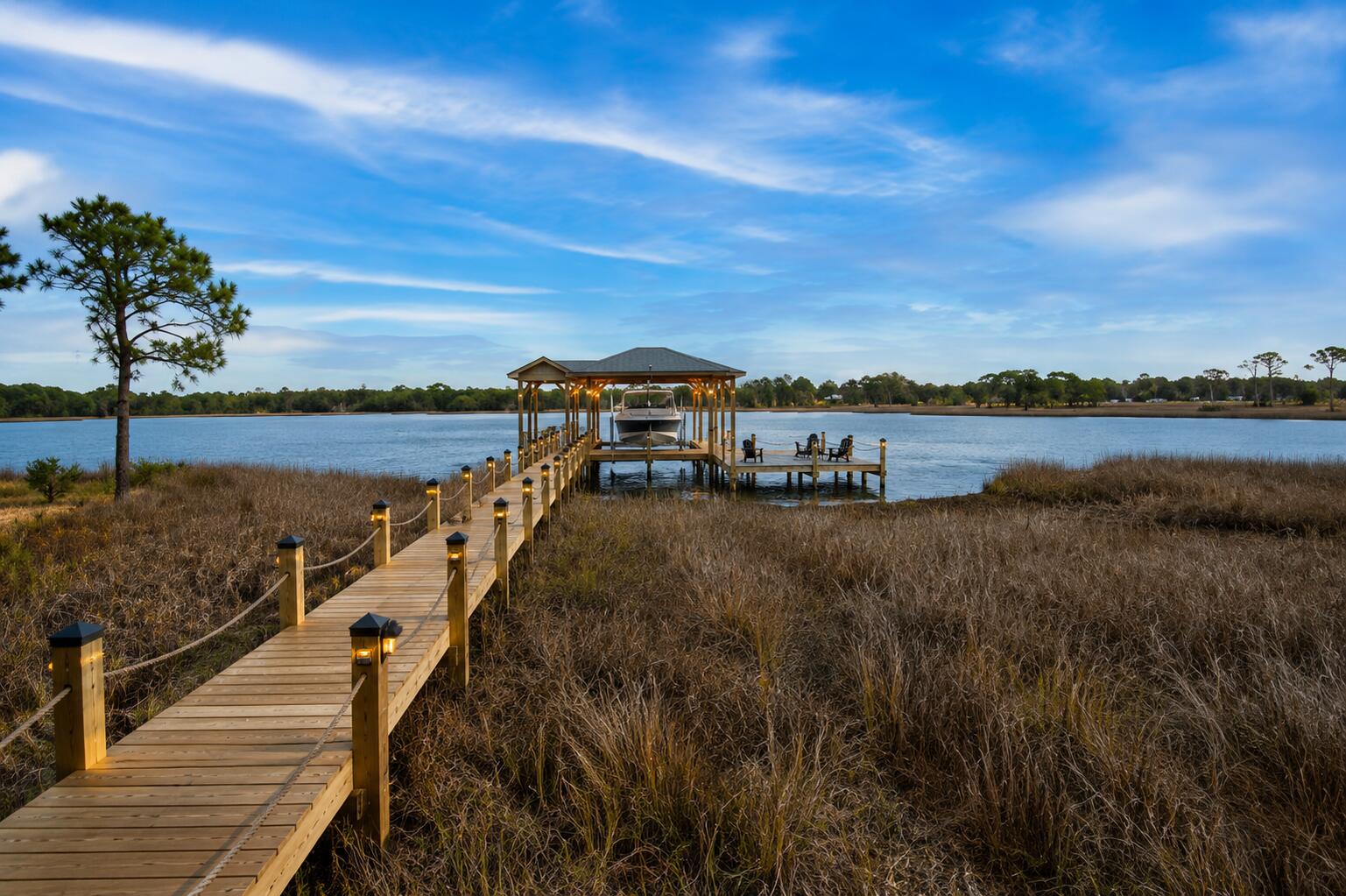 Some homes sit near the water. This one lives on it.
Imagine stepping outside each morning and walking down to your private dock as the sun rises over the bay. The water is calm, the breeze is cool, and the only sounds are the birds overhead and the gentle movement of the bayou. It's the kind of peaceful waterfront lifestyle most people only experience on vacation.
Situated on nearly two acres along the bayou, this property offers something increasingly rare along the Gulf Coast: room to spread out, breathtaking water views, and direct access to the waterfront right from your own backyard. Whether your perfect day involves boating, fishing, kayaking, entertaining friends, or simply enjoying the view from the porch, this property was designed around the water and the lifestyle that comes with it.
As you arrive, you'll immediately notice the sense of privacy and freedom that surrounds the property. With expansive outdoor space and no concerns about where to keep your boat, RV, or recreational equipment, you'll appreciate the flexibility that's becoming harder and harder to find.
Step inside and you'll discover a home that embraces its surroundings. Large windows bring natural light into the living spaces while framing beautiful views of the water beyond. The main living area creates an inviting atmosphere for gathering with family and friends, where conversations flow easily and every room feels connected to the outdoors. The kitchen serves as the heart of the home, offering plenty of space to prepare meals, entertain guests, and create memories around the table. Nearby, the formal dining area is ready for holiday celebrations, family dinners, and special occasions, while additional living spaces provide flexibility for the way you live.
For those working remotely or simply needing dedicated space, the office offers a quiet retreat to focus and be productive. An exercise room creates the convenience of staying active without leaving home, while the workshop provides endless possibilities for hobbies, projects, storage, or creating the ultimate workspace.
At the end of the day, the primary suite becomes your personal retreat. Complete with its own sitting area, it's the perfect place to unwind, enjoy a good book, or simply relax while taking in the peaceful atmosphere that surrounds the property.
Outside is where this home truly becomes something special.
The private dock creates a direct connection to the water and the lifestyle that comes with it. Spend your afternoons fishing from your backyard, launching a kayak, exploring the bay, or simply enjoying the ever-changing scenery. Wide bay views stretch across the horizon, creating a stunning backdrop for everyday life and unforgettable gatherings.
The expansive property offers room for outdoor entertaining, gardening, pets, recreation, and future possibilities. Whether you're hosting summer cookouts, gathering with friends around the water, or enjoying a quiet evening watching the sunset reflect across the bay, every corner of this property encourages you to slow down and enjoy the moment.
Located in the Avalon Beach area of Milton, you'll enjoy the best of both worlds--peaceful waterfront living with convenient access to shopping, dining, schools, healthcare, and major routes connecting you to Pensacola, Pace, and the surrounding Gulf Coast communities.
Properties offering nearly two acres, private waterfront access, a private dock, wide bay views, and the freedom to truly enjoy your property are becoming increasingly difficult to find.
This isn't just a home on the water.
It's a place where every day feels a little more like the life you've been working toward.