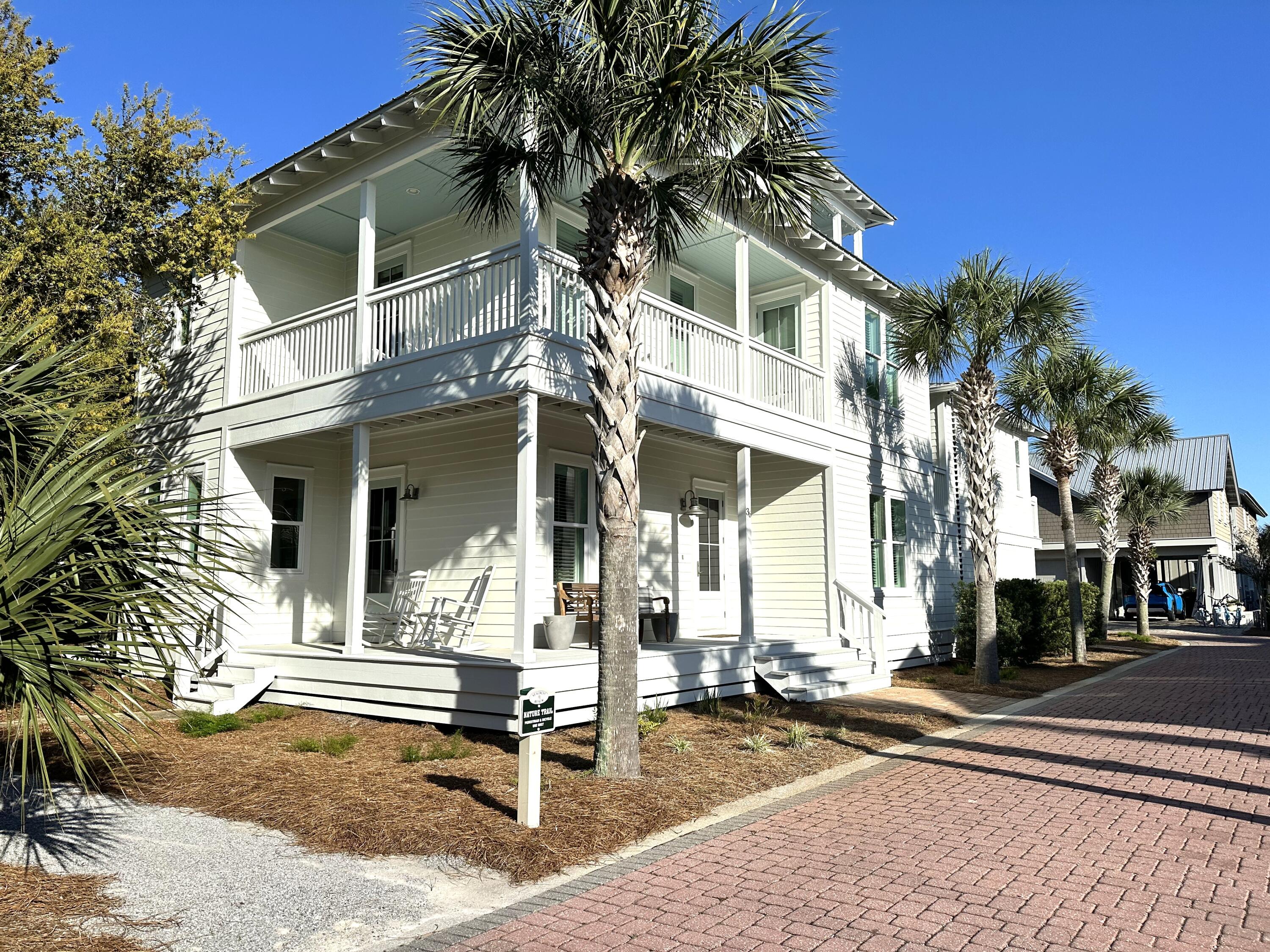 A RARE opportunity to own a home featuring a 2 car garage, private carriage house, and a third-story deck with breathtaking panoramic views in the highly sought-after Seacrest Beach community. This property truly stands apart- combining coastal charm with rare amenities in an unbeatable location. Designed for both comfort and versatility, the layout provides ample space for living, entertaining, or hosting guests. Enjoy deeded beach access to the pristine sugar-white sands and crystalline-green waters of the Emerald Coast.
The living area has been thoughtfully updated with high-end furnishings, creating an elevated and inviting atmosphere.
Recently refreshed with a crisp white exterior and sea-glass aqua accents, this home radiates effortless coastal charm. A spacious wraparound porch provides the perfect setting to enjoy a morning cup of coffee, unwind with an afternoon rest, or relax with guests in the evening.
The kitchen features stainless steel appliances, a breakfast bar, a dedicated dining area, and a generously sized pantry-ideal for both everyday living and entertaining.
The first floor features a spacious bedroom, full bath and laundry closet. Upstairs, the primary suite easily accommodates a king-sized bed and offers a spa-like bath with a soaking tub and a separate shower. The second floor also includes a guest bedroom and a charming bunk room with 4 bunk beds. On the third floor, enjoy beautiful views from the deck, along with a half bath and additional bedroom. Pride of ownership is evident in this property. Owner upgrades include a recently purchased Main house Air Handler and Heat Pump, Carriage House Air Handler and Heat Pump and Main house line set. Beyond the home the community offers a 378,000 gallon pool which is one of the largest private pools in the state of Florida and is open year-round from 9 am-9:45pm for Seacrest residents and guests. The amphitheater is a grassy area where concerts, movies, and weddings are held It is also great for a pick-up game of Bocce or Frisbee throwing. From March - October, the Seacrest Tram service offers transportation to and from the designated tram stops in the neighborhood to the beach or the Lagoon pool.
One of the newest additions to the community is the Seacrest Beach Café operated by Crust Artisan Bakery. The Café is located on the east side of the lagoon and features a delectable menu that is not your typical pool-side snack shack. They have seafood baskets, the classics such as chicken fingers, burgers, po-boys and sandwiches as well as a satisfying kids menu. Additionally, the surrounding area has great shopping, world class golf courses for the golfing enthusiasts and an abundance of restaurants ranging from casual beachfront cafes to fine dining all complemented by stunning gulf sunsets!! What are you waiting for? Buyer to verify all lot and home dimensions. Call me to schedule a showing of this fabulous property and community!!!