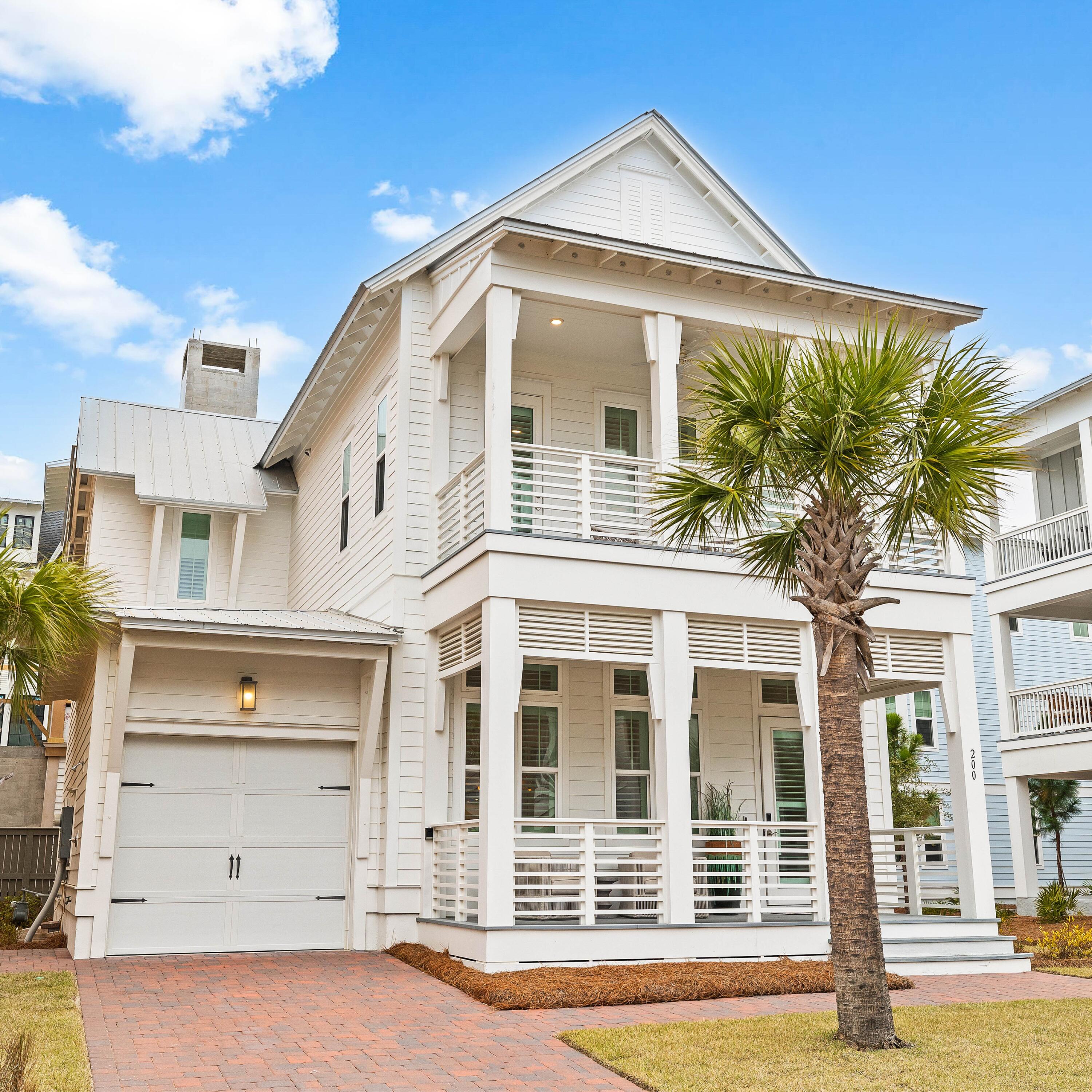With a Full-Price Offer, receive the rare opportunity to enjoy a coveted Watersound Club Membership (pending approval by Watersound Club), elevating an already exceptional 30A lifestyle with access to world class golf, private beach clubs, dining, and resort style amenities.

Welcome to 200 Siasconset Lane, an exceptional coastal retreat gracefully positioned at the end of a private cul-de-sac in Prominence, where sweeping Gulf views and refined architecture create an unforgettable first impression. Never rented and meticulously maintained, this residence presents in pristine condition, offering the feel and quality of a brand new luxury home.

A brick-paved driveway welcomes you to the attached garage, while expansive covered porches on both levels and a private screened porch off the main level primary suite invite seamless indoor-outdoor living. Whether enjoying sunrise coffee, sunset cocktails, or the gentle Gulf breeze, every outdoor space has been thoughtfully designed for relaxation and entertaining.

Inside, timeless coastal elegance meets sophisticated design. Rich LVP flooring, soaring 12-foot tongue-and-groove ceilings with painted beams, and walls of windows bathe the home in natural light while creating an airy, inviting ambiance. Two luxurious primary suites adorned with custom shiplap detailing provide exceptional comfort and privacy.

 At the heart of the home, the chef's kitchen is both beautiful and functional, featuring quartz countertops, a pot filler above the cooktop, premium stainless steel appliances, a spacious pantry, and an oversized island that naturally becomes the gathering place for family and guests. Every finish has been thoughtfully selected to deliver understated luxury and effortless coastal living.
