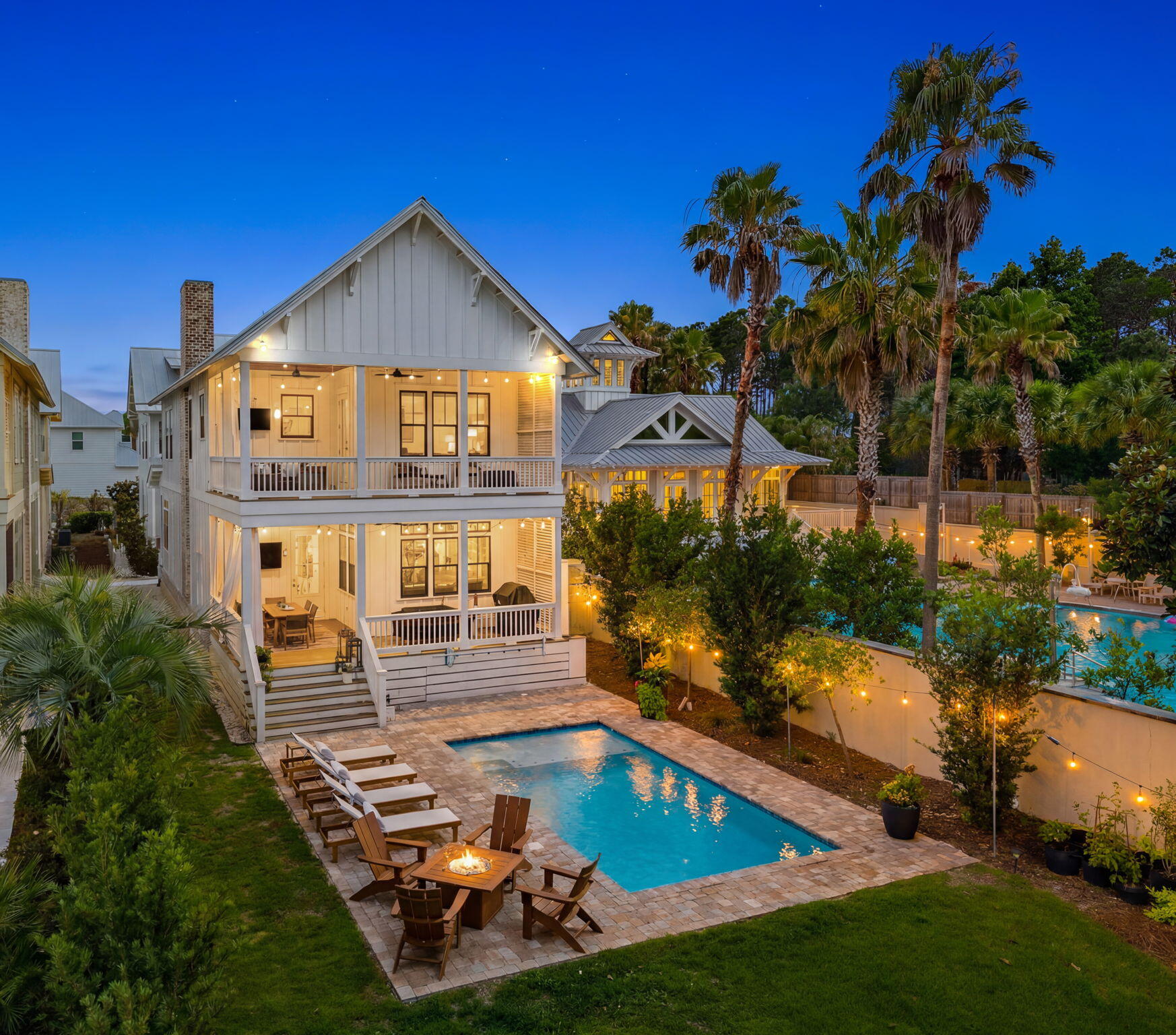 There are few places along the Emerald Coast where life unfolds with the quiet beauty found on the shores of Lake Powell. One of the world's rare coastal dune lakes, its glass-like waters, untouched shoreline, and breathtaking sunsets create a setting that feels worlds away--yet only minutes from the celebrated beaches and charm of 30A. This extraordinary waterfront estate is more than a home; it is a private sanctuary designed for generations to gather, celebrate, and reconnect. Anchored by an exquisitely appointed four-bedroom main residence and complemented by a beautifully crafted guest carriage house, the property offers an unparalleled blend of timeless architecture, refined craftsmanship, and effortless coastal elegance. From the moment you arrive, every detail invites you to slow down. Sunlight dances across the saltwater pool as the lake stretches endlessly beyond. A private dock becomes your gateway to unforgettable days on the water--morning paddleboard excursions through peaceful coves, leisurely cruises across Lake Powell, afternoons spent fishing with family, and evenings watching the sky ignite in spectacular shades of gold and crimson. Included with an acceptable offer, the Hurricane deck boat ensures your waterfront lifestyle begins the day you receive the keys. Inside, every space has been thoughtfully curated to complement the beauty just beyond the windows. The chef's kitchen serves as the heart of the home, anchored by a striking marble waterfall island, professional-grade appliances, and designer finishes that inspire everything from intimate dinners to unforgettable celebrations. Expansive gathering spaces flow effortlessly outdoors, while the tranquil primary suite offers a spa-inspired retreat where every morning begins with peaceful water views. Perhaps the home's greatest luxury is its remarkable balance of seclusion and convenience. Tucked away in one of Inlet Beach's most peaceful waterfront settings, you'll feel completely removed from the pace of everyday life, yet the sugar-white beaches of the Gulf, the architectural beauty of Alys Beach, the vibrant energy of Rosemary Beach, and the timeless charm of Seacrest are all just moments away. World-class dining, boutique shopping, scenic bike rides, and unforgettable beach days are always within easy reach, while the airport is only twenty minutes away. Whether envisioned as a legacy family retreat, an exceptional full-time residence, or a premier investment property, this is a once-in-a-generation opportunity to own one of the most coveted waterfront estates on Lake Powell. Here, luxury isn't measured by square footage or finishes alone--it's measured by sunrise reflections on the water, barefoot evenings on the dock, and the rare privilege of calling one of Florida's most extraordinary coastal landscapes home.