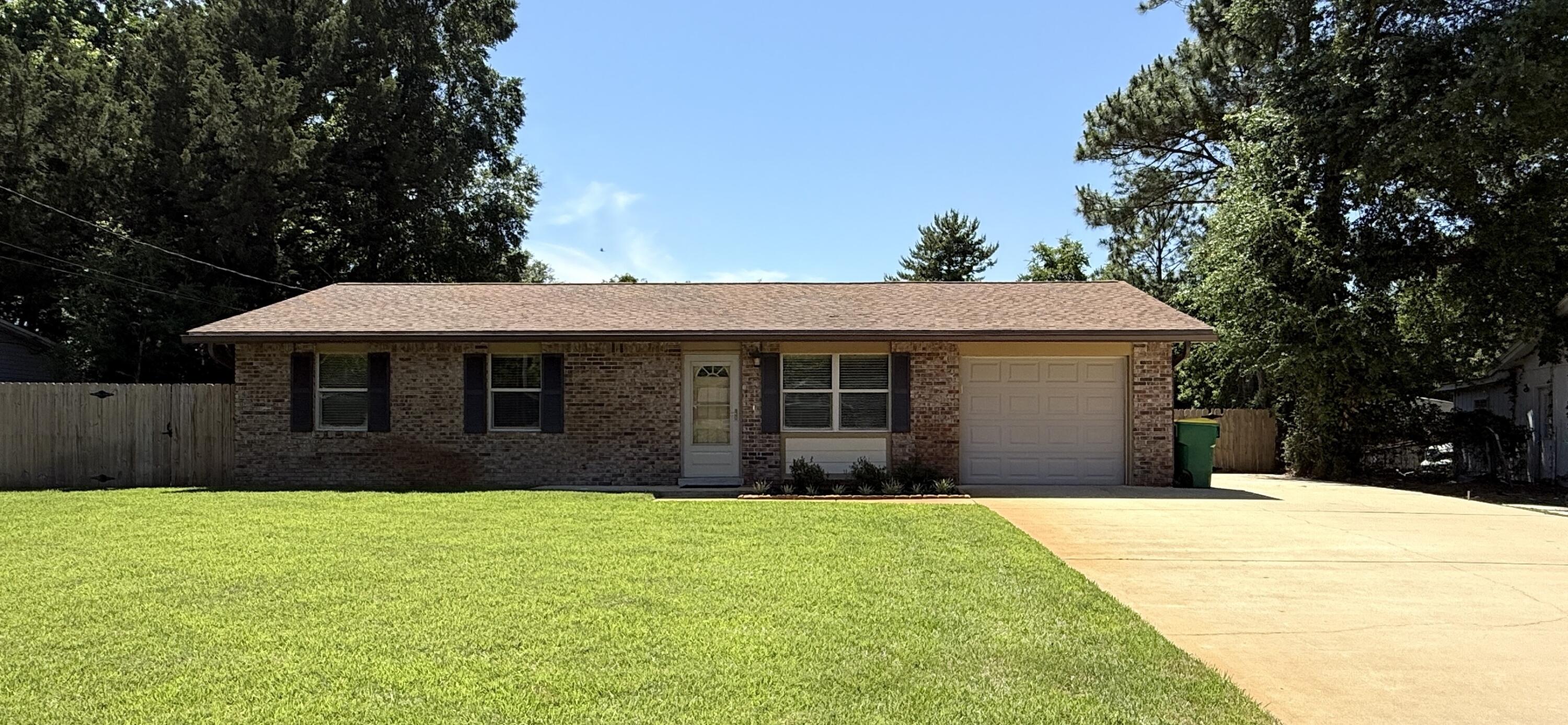 MOVE-IN-READY!  3BR/1.5BA Brick/Hardie Board home conveniently located EAST of Hurlburt & minutes from beaches, bases, & schools! This well-cared for home is nestled in a quaint neighborhood, and has low-maintenance flooring throughout  (NO CARPET), TWO separate living areas. The updated kitchen has wood cabinets with soft-close drawers, granite countertops, and stainless steel appliances. All three bedrooms are generously sized. All doors are Solid Core & closets are cedar-lined!  Major updates include Vinyl Double-Paned Windows (2018); Large Bonus Room (2018); Dimensional Shingled Roof (2018); Electric/Tankless Water Heater; Garage Door (2016); & Updated HVAC (2020). Owner says average power bills are approximately $150/month!  The full bath has an updated vanity & faux marble tub/surround. The half bath also has an updated vanity. Enjoy endless hot water with the electric tankless water heater!  Ceilings have a Spanish Lace texture - No Popcorn!  Outside, the privacy-fenced backyard is perfect for entertaining with 2 patios, lush lawn, wifi sprinkler system, gutters, lawn pump, and extra parking extending beyond the double gate with pavers.  A lg storage building and an additional shed on a concrete slab provide ample storage for tools, lawn equipment, and hobbies.  Termite bond in place with Bryan Pest Control for peace of mind. If you're looking for a well-cared-for home with affordable utilities (approx.$150/mth) & exceptional outdoor space, schedule your showing today!