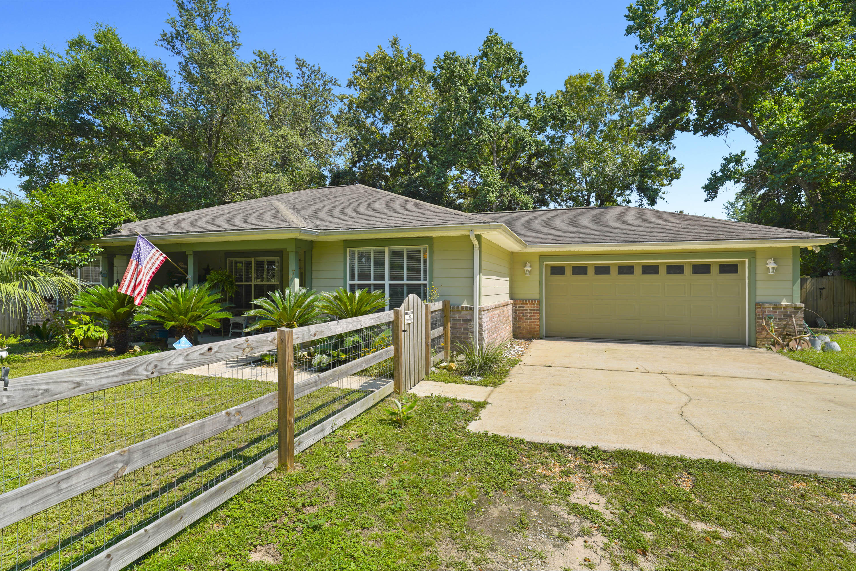 Welcome to this well-maintained 3-bedroom, 2-bath home in Freeport, thoughtfully enjoyed as an artist's retreat. Surrounded by mature oak trees and backing to a wooded area, the property offers a peaceful sense of privacy with inviting indoor and outdoor living spaces. A charming front porch, screened Florida room, and expansive privacy-fenced backyard create the perfect setting to relax, create, or entertain. Don't miss the luxury chicken coop. It is one of those features you just have to see in the photos!

Located approximately 15 to 20 miles from Niceville and Santa Rosa Beach and approximately 10 miles from the Mid-Bay Bridge, the property provides convenient access to beaches, shopping, dining, and major employment centers.

Additional features include a washer and dryer, two full bathrooms, no HOA restrictions, and an extra-large backyard with plenty of room to enjoy the outdoors. Whether used as a primary residence, second home, or long-term rental property, this home offers flexibility and value in one of Walton County's growing communities.

Conveniently located within approximately 20 to 25 miles of Gulf beaches, Santa Rosa Beach, Niceville, Destin, and other Emerald Coast destinations.