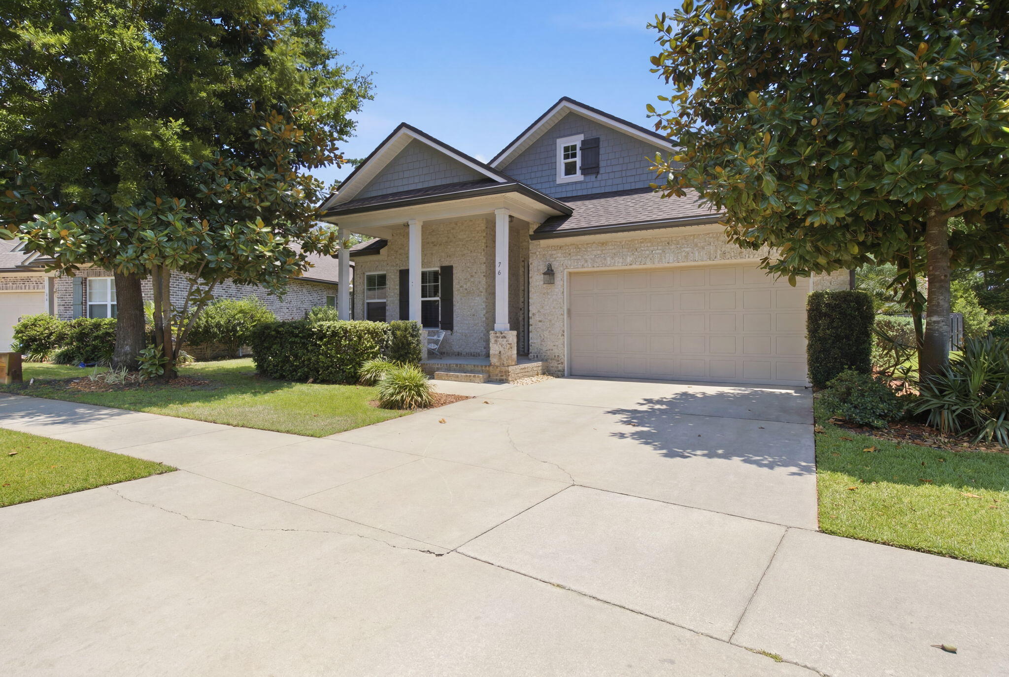 Welcome to 76 Oaktree Blvd, a beautifully maintained, one-story brick home built by Randy Wise, tucked under mature magnolia trees on a quiet street in Freeport's desirable Marina Village. Inside, an open-concept layout connects the kitchen, dining, and living areas. The kitchen features granite countertops, stainless steel appliances, a large center island with bar seating, and a built-in coffee/wine bar. The split floor plan provides three bedrooms plus a dedicated home office. The large master bedroom includes a sitting area, a walk-in closet, and a spa-style master bath with huge walk-in shower and dual vanities. Two guest bedrooms, including a mermaid-themed room, share a Jack and Jill bath with dual vanities. The extended, screened rear porch overlooks a fenced and beautifully landscaped backyard -- a private, low-maintenance retreat with ceiling fans and a wall-mounted TV, perfect for year-round enjoyment. The two-car garage includes built-in storage shelving. Marina Village offers a community pool, playground, and pond with dock. Close to Hwy 20, just minutes from a brand-new marina currently under construction on the bay, and a short drive to Freeport shopping, dining, and the beaches of the Emerald Coast. Some furnishings included -- move-in ready for a primary residence, second home, or investment property.