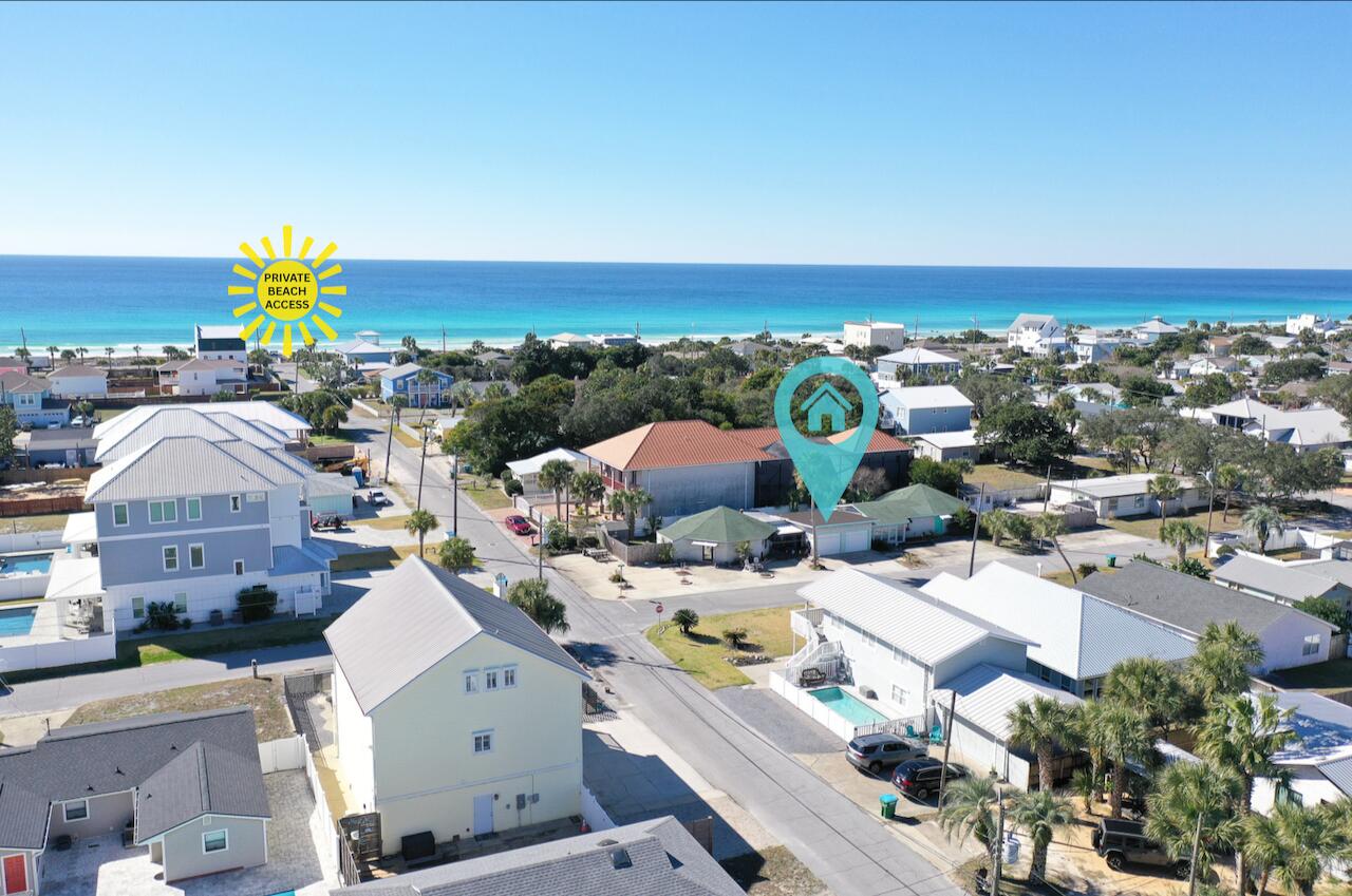 Rare opportunity in Bid-A-Wee, one of Panama City Beach's most sought-after neighborhoods and one of the only beach communities on PCB's 26 miles of sugar-white sand, with private gated deeded beach access. THIS MULTI-FAMILY PROPERTY ALLOWS SHORT TERM RENTALS! The parcel features two separate units, offering exceptional flexibility for homeowners and investors. Live in one side and rent the other, or maximize income by renting both! The 13801 Bay Ave side is approximately 1,200 square feet, three bedrooms, two full baths with interior updates, along with a sunroom/breezeway. Two single-car garages connect the properties with each having a private fenced back lawn, grilling area and more! The second residence, 500 Albatross Street, is approximately 1,100 square feet with 3 bedrooms and 2 full baths, covered front porch, and its own garage connection, providing privacy and functionality for guests or tenants. Parking is not a problem with this property! Be at the Gulf within a three-minute walk or 30-seconds in a golf cart, and owners may opt into the Bid-A-Wee Beach Park amenity for a nominal annual fee, granting access to the gated beach entrances. Centrally located near Pier Park, dining, shopping, entertainment, and nightlife, this property delivers the perfect balance of beach lifestyle, neighborhood charm, and income potential. Dimensions approximate, please verify if important.