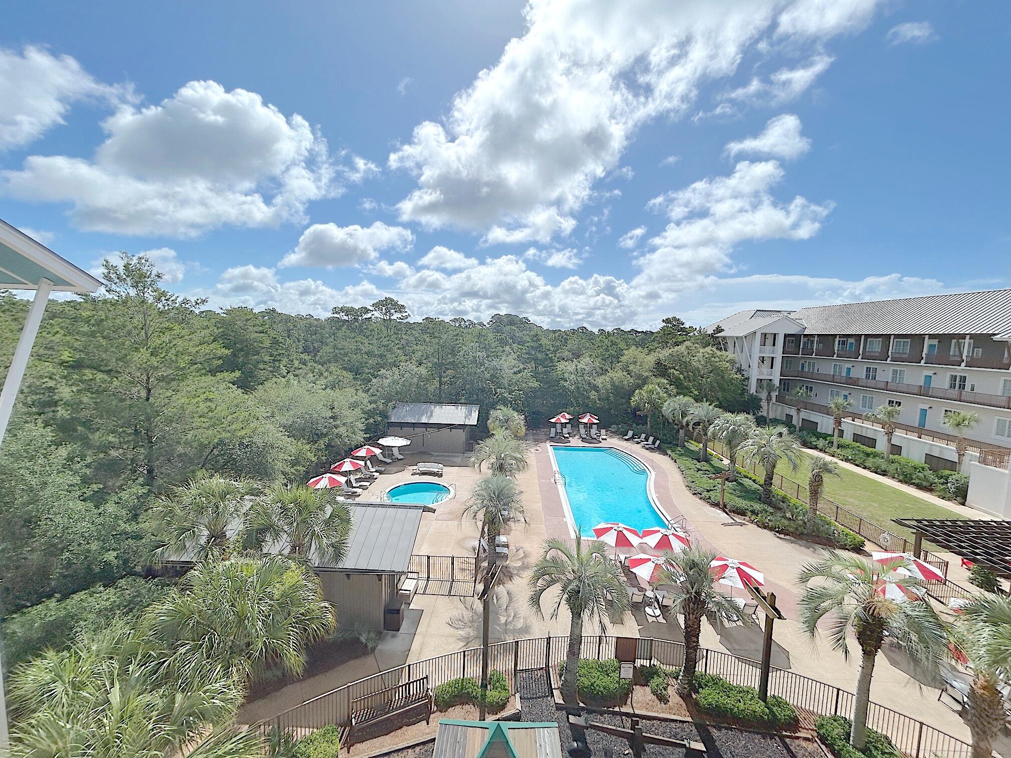 Welcome to Redfish Village Unit M1413. A  beautiful 2 bedroom 2 bath condo featuring a gulf view from your top story balcony to take in the views, the gulf breeze, and sunset right from your balcony. A bright open kitchen with granite countertops and stainless steel appliances overlooks the dining and living area. Tall smooth ceilings with wood floors and fresh new paint throughout provides a tranquil retreat for you and your guests. Large bedrooms with walk in closets and plenty of room to set up the areas to fit your needs. The unit has elevator access, covered reserved parking space, and room to store your bikes. Redfish Village offers top notch amenities Including: Private deeded beach with bathrooms, BBQ grill area,  Heated Pool with large hot tub, Fitness Room, Playground, Theatre, Library, Private dock overlooking Redfish dune lake, and a large lawn area. Great convenience to the white beaches of the Emerald Coast, and also right in the middle of dining options, live music, bike shops, ice cream parlors, and more to enjoy for your shopping and entertainment.