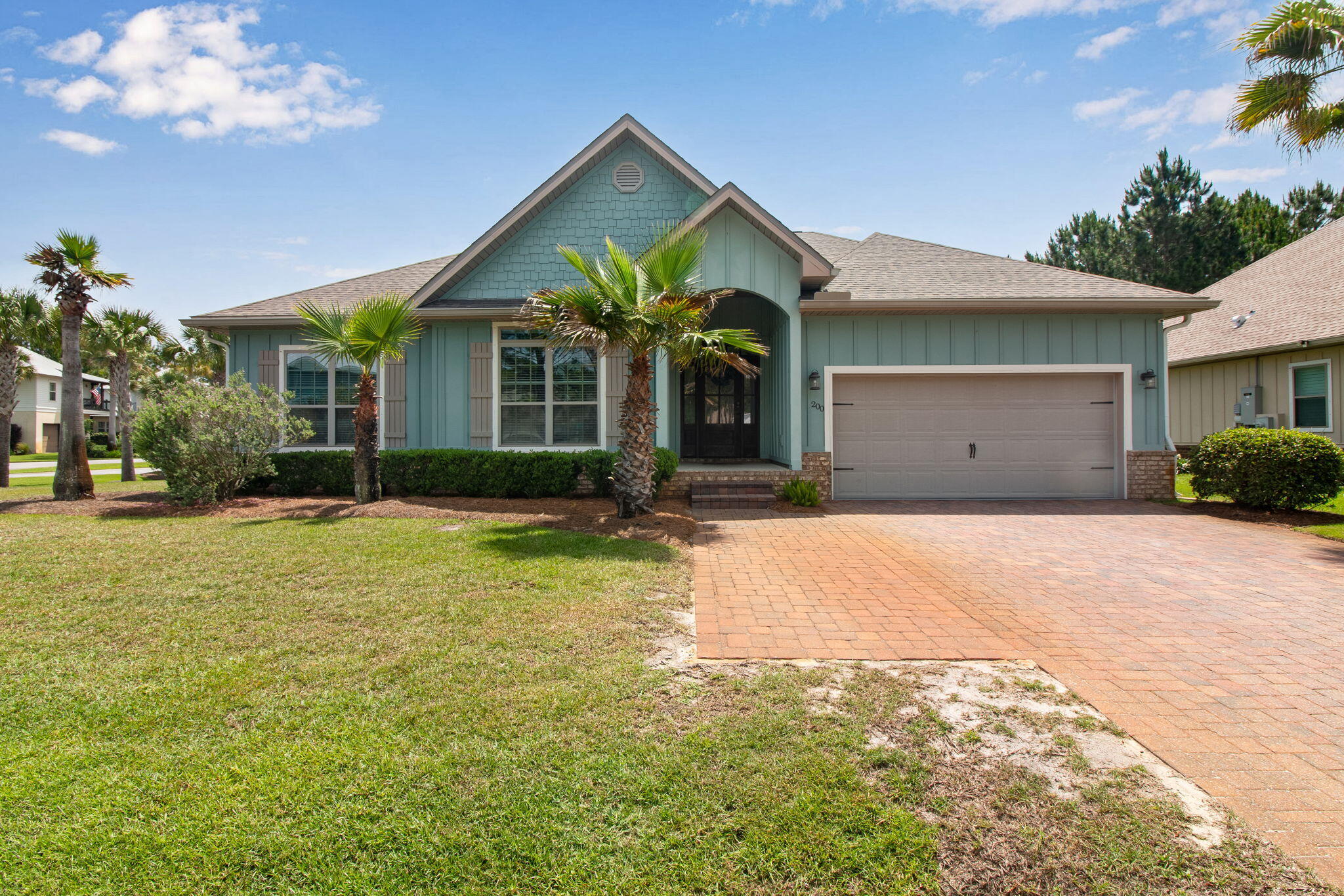 Welcome to coastal living along the 30A corridor. This beautifully maintained residence offers the perfect blend of comfort, style, and low-maintenance living just minutes from the sugar-white beaches and emerald waters of the Gulf Coast.
From the moment you arrive, you'll appreciate the home's charming coastal architecture, paver driveway, manicured landscaping, and welcoming front entry. Inside, soaring tray ceilings, crown molding, plantation shutters, and luxury flooring create a bright and inviting atmosphere throughout.
The open-concept floor plan is ideal for both everyday living and entertaining, featuring a spacious great room that flows seamlessly into the dining area and kitchen. The kitchen offers stainless steel appliances, abundant cabinetry, a large center island, generous counter space, and a functional layout designed for gathering with family and friends.
The spacious primary suite serves as a private retreat with a tray ceiling, spa-like ensuite bath featuring dual vanities, an oversized walk-in shower, and ample storage. Additional guest bedrooms and baths are thoughtfully designed to provide comfort and privacy for family and visitors alike. Outside, a vine-covered pergola creates an inviting outdoor living space perfect for al fresco dining and entertaining. Residents also enjoy access to a beautiful resort-style community pool, offering the perfect place to cool off after a day on the Emerald Coast or spend leisurely afternoons enjoying the Florida 
lifestyle.
Conveniently located near 30A, Grand Boulevard, Sacred Heart Hospital, championship golf courses, shopping, dining, and world-famous beaches, this exceptional home delivers the relaxed coastal lifestyle that makes Santa Rosa Beach one of Northwest Florida's most sought-after destinations.