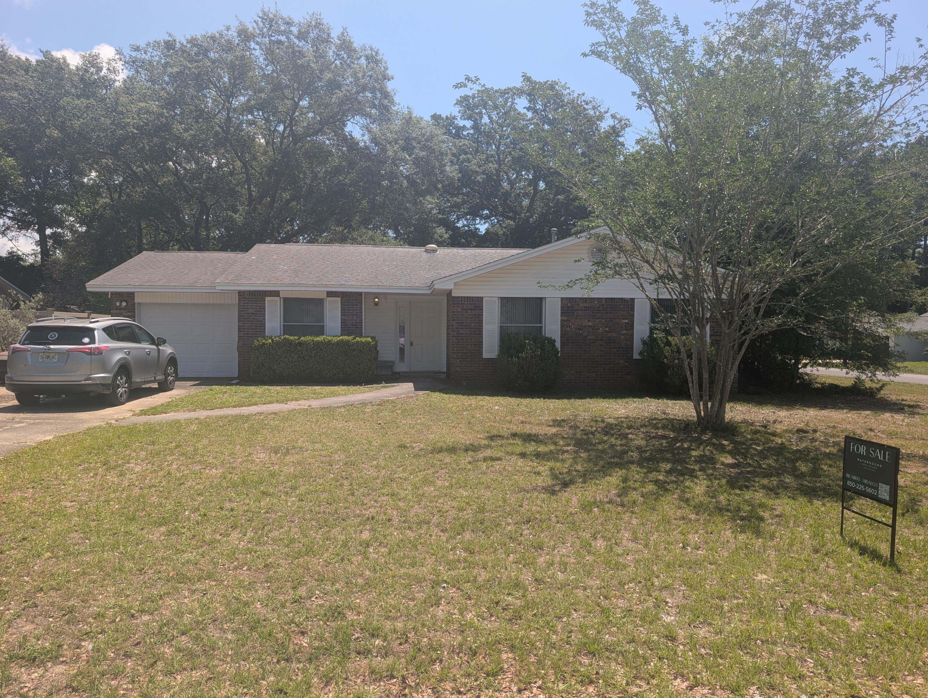 NO HOA!!! This property sits on a spacious corner lot with oversized parking and excellent accessibility, featuring a side entrance to the backyard with an additional small driveway -- perfect for extra vehicles, boats, trailers, or future improvements. The large lot offers plenty of room to expand, entertain, or create your ideal outdoor space. Inside, the home has solid bones and several valuable updates already completed, including an HVAC system that is approximately 6 years old and a newer water heater. The layout includes a great Florida room located off the primary bedroom, creating a flexible space for relaxing, an office, sitting area, or additional living space with views of the backyard. The home does need cosmetic work and updating, making it an excellent opportunity for sweat equity.