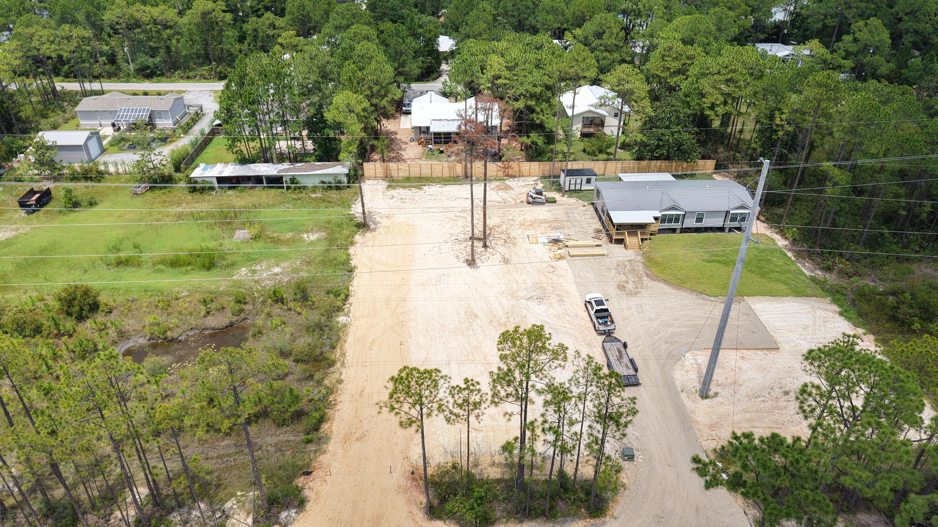 Located just minutes from the beaches of 30A and all the shops, restaurants, and conveniences of Grand Boulevard, this cleared lot is prepped and ready for your dream home. Whether you're looking to build a primary residence, second home, or investment property, this spot offers the best of both worlds. Tucked away from the hustle, but close to everything.