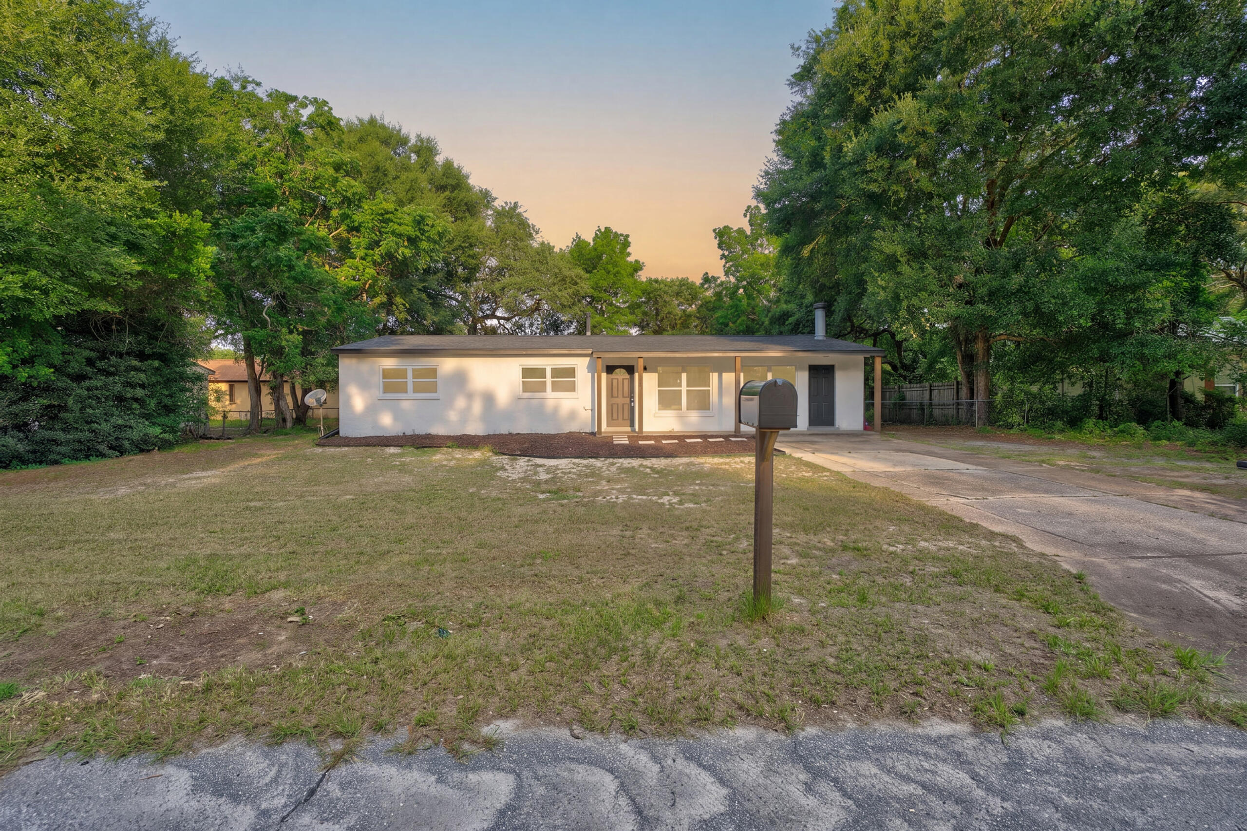 Welcome home to this beautifully remodeled 4-bedroom, 2-bath residence perfectly situated in the heart of Fort Walton Beach. Offering an unbeatable location just minutes from both Eglin Air Force Base and Hurlburt Field, this move-in ready home combines modern updates with everyday convenience. Step inside to discover an inviting split floor plan featuring brand-new luxury vinyl plank flooring throughout and fresh interior finishes designed for today's lifestyle. The stunning kitchen has been completely transformed with new hardwood soft-close cabinetry, elegant tier 2 quartz countertops, a deep farmhouse-style sink, and a full suite of brand-new stainless steel appliances-creating the perfect space for both entertaining and daily living. Additional upgrades provide peace of mind for years to come, including a brand-new roof, new HVAC system, new water heater, and all new interior doors throughout the home. The spacious layout offers four generously sized bedrooms, providing flexibility for growing families, guests, or a home office. Outside, you'll find a large lot with an expansive backyard offering endless opportunities for outdoor enjoyment, gardening, or future additions. With plenty of parking options available, there's ample space for multiple vehicles, recreational equipment, or visitors. Don't miss your opportunity to own this fully updated Fort Walton Beach gem in a prime location close to military bases, shopping, dining, schools, and the beautiful Emerald Coast.