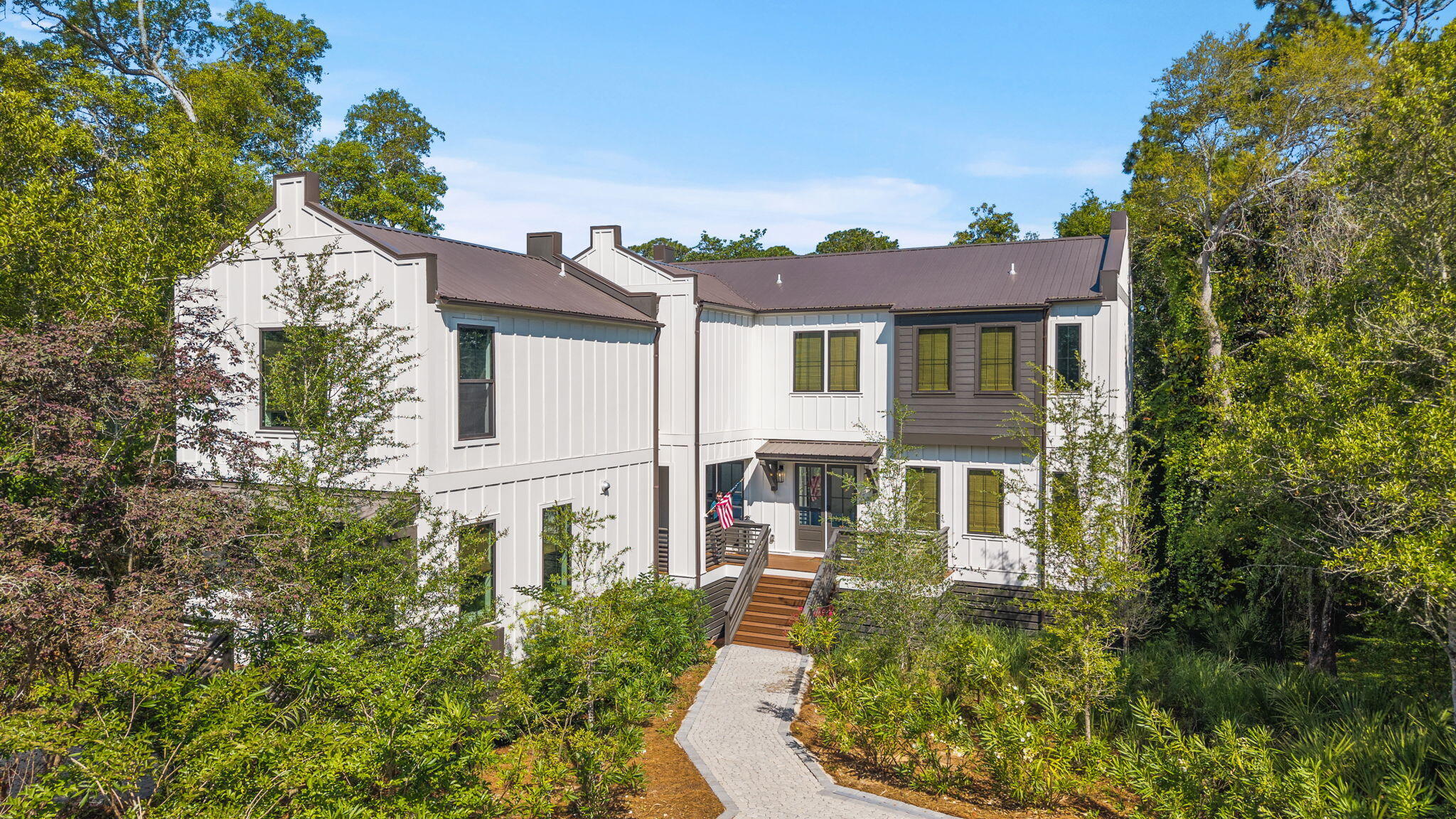 HOME & CARRIAGE HOUSE ON 30A- JUST 0.2 MILES TO BEACH ACCESS,  NO HOA FEES! Welcome to your Next Home!  Built in 2024, this home is conveniently located at the west end of 30A on nearly a ¼ acre with natural tree canopy for privacy. Enjoy views of the Gulf and Lake Stallworth from the back porch and bedroom balconies of the main house.  The main house features an open concept kitchen, living, and dining area with 4 bedrooms, built in bunks, and 3.5 baths, to accommodate sleeping up to 10 people.  The carriage house offers a completely separate living space with a full kitchen, living area, bath, laundry, king bed, built-in bunks, and its own parking to accommodate an additional 4 people. Being sold fully furnished, this property is ready for purchase! Whether you're looking for a primary residence, second home, multi-generational living, or investment opportunities- this home is a must see! 

Three Nearby Beach Access Points:  Beach Highlands, Dune Allen Regional, and Dune Allen