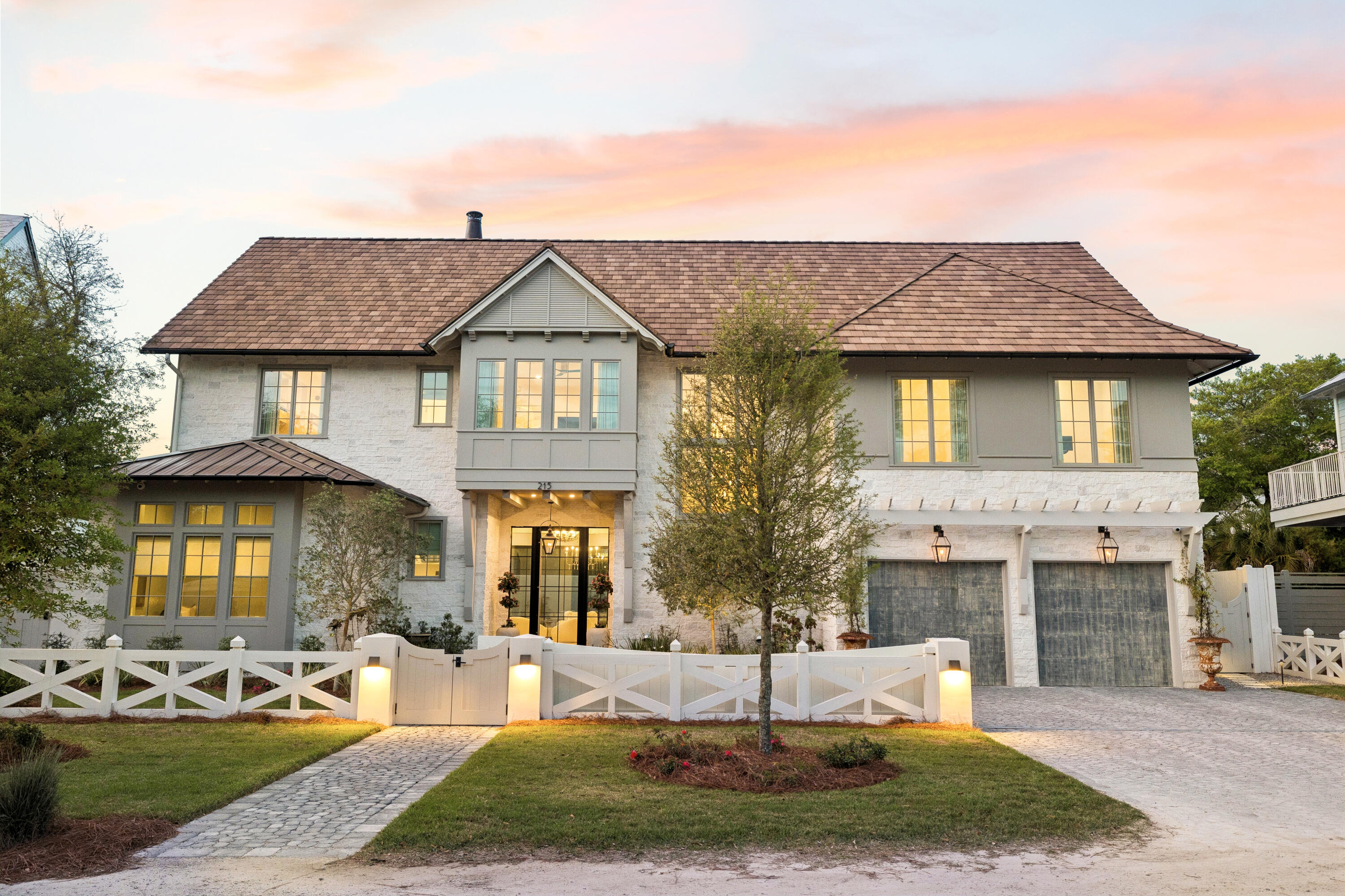 Quietly set behind custom fencing and curated landscaping, this home reveals itself through materials, proportion, and restraint rather than excess. Approached through a gated entry and landscaped courtyard, the residence establishes a sense of privacy and intention from the outset. A cobblestone drive, olive trees, and the sound of a fountain set a quieter tone--more retreat than residence.

Inside, the materials do the work. Reclaimed French limestone underfoot, hand-finished plaster walls, and antique beams create a sense of permanence that is difficult to replicate. The main living spaces unfold gradually, not all at once--designed to feel discovered rather than exposed. The interior sequence continues with a measured progression through the home's primary living areas. Ceiling heights shift subtly, creating variation without disrupting continuity, while sightlines are maintained to preserve openness. Natural light is controlled rather than maximized--filtered, directional, and consistent throughout the day. Circulation is intuitive, allowing movement from one space to the next without interruption or excess.

The kitchen and adjacent living areas read as a single environment. Surfaces remain understated, emphasizing texture over contrast, while Sub-Zero and Wolf appliances are integrated without drawing attention. A fully equipped butler's pantry supports the space, keeping the primary kitchen functional and visually calm during entertaining.

The central living area opens fully to the outdoors through expansive glass doors, dissolving the boundary between interior and exterior. Openings are wide but deliberate, reinforcing connection without excess. What follows is a sequence of spaces built for use: covered seating, a summer kitchen, and a pool and spa environment that functions as a true extension of the home. It's designed for long afternoons and evenings that don't require leaving the property.

The primary suite is positioned for privacy and separation from the main living areas, functioning as a true retreat within the home. The bedroom itself is restrained in scale and detail, allowing proportion, light, and material to define the experience rather than decoration. The primary bath follows this same approach--quietly executed, consistent in material, and designed to support daily use without drawing attention.

A dedicated office is positioned with intention--quietly removed yet integrated into the overall flow. It functions as a true workspace, with appropriate scale, light, and privacy for extended use.
Private spaces are intentionally separated. Guest suites and bunk-style accommodations allow for scale when needed, while maintaining comfort and privacy. An upstairs living area with a full bar creates a secondary gathering space, ideal for guests or extended stays.

A private-entry apartment adds another layer of flexibility--suitable for long-term visitors, staff, or independent living within the home. Throughout, the house balances refinement with practicality: multiple laundry areas, integrated storage, and a lower level that can function as a gym, wellness space, or retreat.

The result is a property that lives well over time--durable, private, and intentionally designed for repeat use, aligning with how a second or third home is truly experienced.