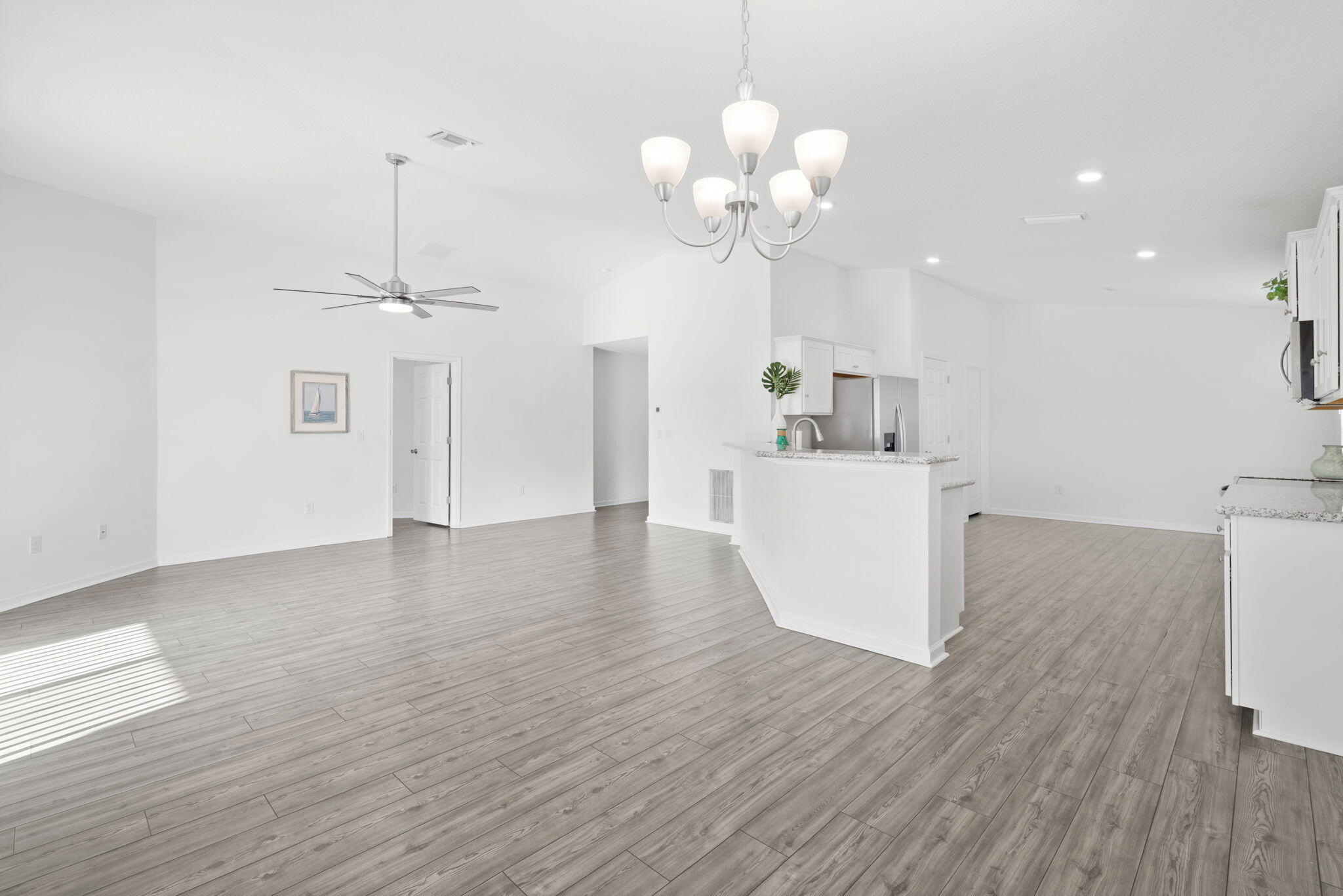 LIKE NEW, 2022 Holiday Builder Home in great neighborhood w/comm pool, gym & dock! Located S.of Hwy 20, Publix, restaurants & schools are close by, while at the same time enjoy the white sandy beach & crystal blue waters of the Gulf just 20 min away! Taking center stage, this Home's big, eat-in kitchen w/granite counters, pantry & large eating bar flows effortlessly into the spacious living area. It's oversized, master suite, located away from the other BR's, provides privacy & plenty of room for a sitting or office area.  A small, LOW maintenance yard w/covered patio provides the ideal spot for your morning coffee or dining al fresco. Close by, the comm pool, dock & gym allow you to enjoy the Fl. lifestyle WITHOUT YOU having to worry about any of the upkeep. Come see this Home today!