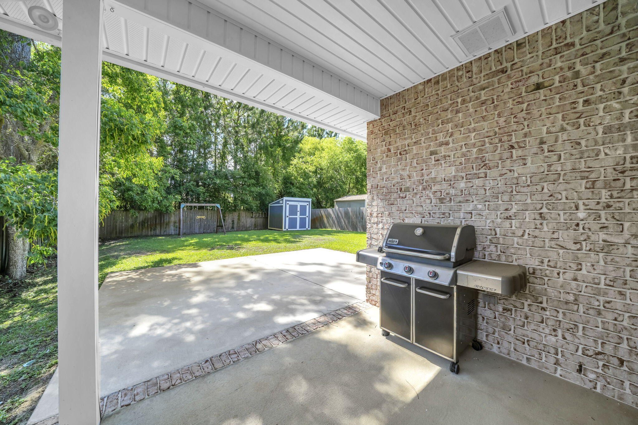 BETTER THAN NEW!  NO Association here!  Room for a POOL!  ALL Brick.  All Brick, open floor plan, 4 bedrooms and 2 bathrooms. in the center of Niceville.  As you walk into your beautiful home, you see your dining room and kitchen, with modern light fixtures and recessed lighting.  The warm kitchen cabinets, granite counter tops, and sizeable bar are perfect for entertaining, or for just enjoying family meals.  The large family room has trayed ceiling, and opens to a large, covered patio in a fully fenced oasis.  The storage building is perfect for storing lawn care items while your children play on the swing set.  French drain has been installed by the sellers, preventing any settling water.  An expansive master suite features trayed ceilings, a large walk-in closet, and an ensuite with a walk-in shower, double vanities, and a linen closet.  A distinct hallway off the main living area accessed three additional bedrooms, and a shared full bath with double sinks.