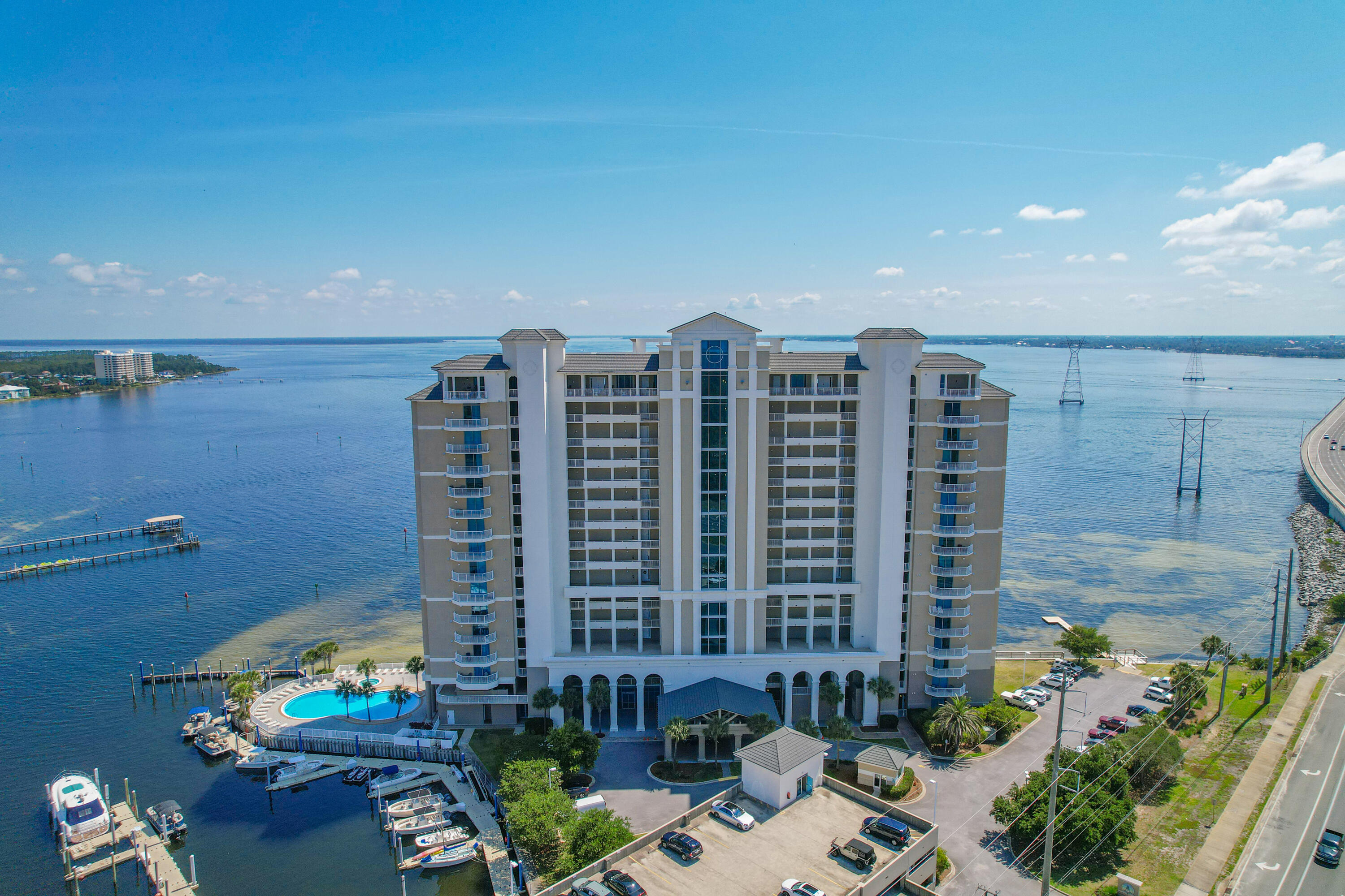 MOTIVATED SELLER BRING OFFERS. Experience elevated coastal living in this exquisite 3-bedroom, 3-bathroom Bayfront residence offering breathtaking panoramic views of St. Andrews Bay. Thoughtfully designed to capture the beauty of the water from nearly every vantage point, this exceptional condo features an expansive private balcony--an ideal setting for entertaining, relaxing with a glass of wine, or enjoying unforgettable sunsets overlooking the bay. Inside, the light-filled open-concept layout showcases refined finishes and spacious living areas designed for both comfort and style. Floor-to-ceiling sliding glass doors frame the water views and open seamlessly to the oversized balcony, creating a true indoor-outdoor living experience where the beauty of the bay becomes part of everyday life. The balcony also features a built-in grill, making it the perfect space for outdoor dining and entertaining. The thoughtfully designed split floor plan offers both privacy and functionality, highlighted by two private waterfront primary suites, each featuring stunning bay views and direct balcony access--creating peaceful retreats for owners and guests alike. Assigned parking spaces 9 and 81. New stove 23, HVAC system and water heater 2021, storage room in breezeway.

The beautifully renovated kitchen combines modern elegance with everyday practicality, featuring black stainless appliances, a deep black undermount sink, and upgraded finishes that complement the home's contemporary coastal style. Recessed lighting throughout the residence enhances the bright, sophisticated atmosphere, while upgraded sliding doors with soft-touch rollers provide effortless access to the balcony.

Residents of Marina Landing enjoy an exceptional array of resort-style amenities, including a stunning bayfront pool and hot tub, a well-appointed fitness center, and a conference room. Boating enthusiasts will appreciate the private deep-water marina with quick access to the Gulf. Additional conveniences include a private exterior owner storage closet and a covered assigned parking space (#), along with convenient first-floor ramp parking visible from the front balcony--offering rare ease and accessibility.

This is more than a residence--it is a lifestyle defined by waterfront beauty, luxury comfort, and effortless coastal living.

Don't miss the opportunity to experience the very best of bayfront living.