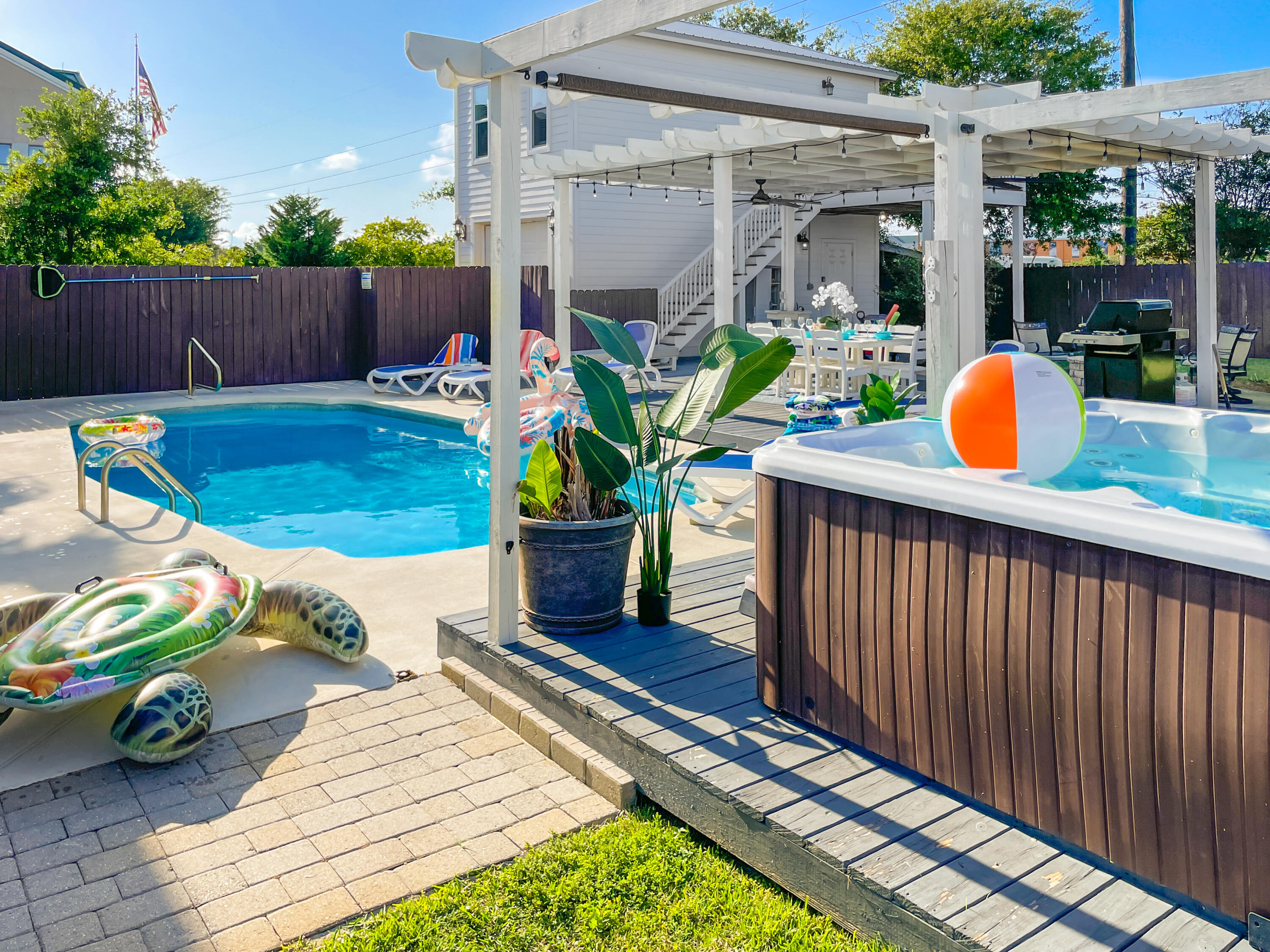 Welcome to Seas The Moment, your opportunity to own a high-performing vacation rental and unforgettable beach retreat in Destin's sought-after Crystal Beach neighborhood. Just a half-mile from the sugar-white sands of the Gulf, this stunning property brings in over $230,000 in annual rental income—and offers everything today's travelers (and owners) are dreaming of.

Set on a rare lot and a half, the estate comfortably hosts up to 14 guests and 8 vehicles, with a 4-bedroom main home and two separate carriage house studios—perfect for multi-generational stays or maximizing rental flexibility. Whether you're entertaining family, hosting friends, or welcoming guests, this home delivers. Outdoors, unwind in your private backyard oasis with a sparkling pool, hot tub, and firepit,