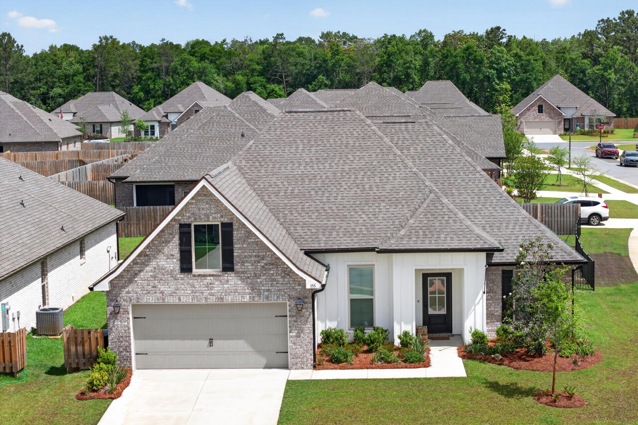 Your Florida Dream Begins Here -- Wrapped in Upgrades, Warmth, and a $120K Backyard Paradise!!!

Some homes invite you in. This one welcomes you home! From its sunny corner lot in the Starburst neighborhood of Hammock Bay, this 2025 residence stands apart--not because it's new, but because it's complete. While most new construction homes offer the basics and leave the rest to your imagination (and your wallet), this one has already been thoughtfully elevated with the upgrades, comforts, and lifestyle features buyers dream of but rarely find ready and waiting.

The moment you step inside, the story begins with light--soft, warm, and beautifully intentional. LED lighting throughout, paired with window blinds already installed, creates a polished, move in ready atmosphere. Wood look ceramic tile flooring stretches across the entire home, offering durability, elegance, and easy Florida living without the patchwork of mixed flooring you often see in new builds.

The living room immediately draws you in with its custom accent wall, where an electric fireplace and TV center above the mantel create a rich, inviting focal point. It's the kind of feature that transforms a house into a home--something you simply won't find in a builder's standard package. And then, the heart of the home: the kitchen....
Here, every detail has been elevated beyond builder grade. Quartz countertops, soft close doors and drawers, upgraded backsplash, matte black faucet accents, and under-cabinet lighting come together to create a space that feels both modern and timeless. The large island, pendant lighting, gas stove, and walk in pantry with custom shelving make this kitchen as functional as it is beautiful--ready for quiet mornings, lively gatherings, and everything in between.

The dining area flows naturally toward the covered back porch, where the home's most breathtaking feature awaits: a $120,000 custom saltwater, heated gunite pool and oversized spa. This is not the kind of pool you add later. This is a resort style retreat crafted with marble coping, mosaic tile, LED lighting, tanning ledge, raised spa with waterfall, and a premium automation system. Surrounded by a fully fenced backyard, it offers privacy, beauty, and instant lifestyle value that new construction simply cannot match.

The primary suite continues the theme of comfort and luxury, featuring a tray ceiling, crown molding, and a serene private bath with a garden tub, double vanity, custom tile shower, and two walk in closets. Across the home, the additional bedrooms offer privacy for guests or family, while the flex space near the foyer adapts effortlessly to your needs--office, reading nook, playroom, or creative studio.

Throughout the home, thoughtful upgrades add convenience and long term value:
*Gutters installed around the entire home
*Exterior soffit electrical outlet
*Smart Wi Fi thermostat
*Energy efficient windows and water heater
*Pull down attic stairs and added shelving
*Flood lights and landscaping package
*Natural gas already installed (a rare and valuable feature in this neighborhood)

These are the upgrades that cost thousands--and months--to add after closing on a new build. Here, they're already done. Already paid for. Already yours.

Every day feels brighter in Hammock Bay, where resort-style amenities, natural beauty, and a warm neighborhood atmosphere come together to create a lifestyle people fall in love with. Beyond the home itself, residents enjoy pickleball courts, a 4,000-sq-ft fitness center, playgrounds, community pools, and miles of sidewalks that make it easy to stay active and connected.

This isn't just a home that's move-in ready--it's life-ready. The upgrades are complete, the comforts are built in, and the Florida lifestyle begins the moment you arrive.

Set across more than 3,000 acres of preserved natural surroundings, Hammock Bay offers over 12 miles of sidewalks, nature trails, and bike paths that link every corner of the community. Multiple resort-style pools, a 25-meter lap pool, lighted basketball, tennis, and pickleball courts, putting greens, picnic areas, outdoor cooking spaces, and a charming general store create a setting where convenience meets recreation.

Canine Commons provides two dedicated dog parks--one with washing stations and water bubblers--while the nearby 60-acre sports park expands athletic opportunities even further.

At Town Square, an open-lawn amphitheater hosts concerts, movies, festivals, and community events. Local dining, rotating food trucks, and gathering spaces bring neighbors together in a lively social hub. For those who love the water, Steamboat Landing offers 480 feet of shoreline along Choctawhatchee Bay, a 500-foot dock, fishing pier, bayfront clubhouse, and a covered pavilion perfect for sunset views.

Located in Freeport--one of Northwest Florida's fastest-growing bayfront communities--Hammock Bay provides easy access to the beaches of South Walton, Scenic 30A, Destin, Niceville, major airports, and Eglin and Hurlburt Air Force Bases.

This is more than a home. It's a place where spacious design meets resort-style amenities, where lake views greet you each morning, and where every day feels like a well-earned retreat.

Please note: All information is deemed to be accurate. Buyers are responsible to perform due diligence to verify all information of importance to them.