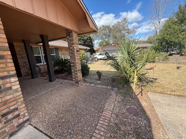 Elegant brick home located in the desirable Kenwood Neighborhood with 4 bedrooms, 2 bathrooms and 2332 sq ft. This home is close to the bases, beaches, shopping and restaurants. The home has a new 30 year dimensional shingle roof! Enter the home into the foyer and notice the large home office or bonus room to the right! This room boast three large picturesque windows allowing a view of the cul-de-sac and natural light to abound. On the opposite side of the foyer is a dining room. The floors are tiled with 20 inch tile laid on the diagonal. The home has an open floor plan with the kitchen opening to the living room. There are built in book cases in the living room and a fireplace with a mantel. The fireplace has a tiled surround. The kitchen has wood, shaker style cabinetry with brushed nickel hardware. There is a wall oven, electric cooktop, rangehood, French Door stainless refrigerator, and black dishwasher. The island is large can seat up to 4 guests. There are granite countertops and pendant lighting over the island. The  laundry room and pantry with built in shelving are adjacent to the kitchen. The guest bathroom has a large white, shaker vanity, new lighting, and mirror. There is a tub and shower with tiled surround and a rain head shower, faucet. There are three guest bedrooms and one primary bedroom. The primary bedroom is large and has a large walk in closet with built in shelving. The primary bathroom has a double vanity with a cultured marble top, towel closet, tub and shower with tiled surround and a rain head shower faucet.  Exit the home through the French doors to the covered back patio. The home has a brick veneer, wood trim, front and back covered patios, gutters, a privacy fence and a storage shed. Buyer to verify all dimensions and information.