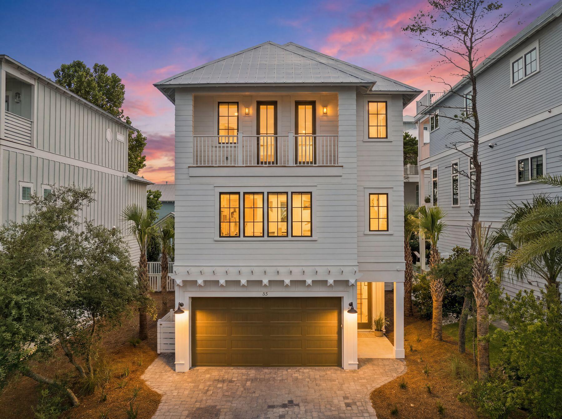 Completed New Construction in Grande Pointe at Inlet Beach. Nestled within the thoughtfully developed community of Grande Pointe, this exquisite three-story residence by 30A Builders seamlessly blends coastal design with contemporary elegance. Offering over 2,900 square feet of heated living space, the home is thoughtfully designed across three spacious levels, delivering a harmonious balance of style and function. Inside, rich hardwood flooring flows throughout, complementing the 10-foot ceilings and tongue-and-groove wood accents that add warmth and character to the home. With the convenience of an elevator designed to service all floors.

The heart of the home is a beautifully appointed kitchen featuring custom cabinetry, a 48'' range, dishwasher, and  large pantry. Estimate completion date end of May 2026 The open-concept layout continues into the expansive great room and dining area, ideal for gathering and entertaining. The living room features a sleek horizontal fireplace and French doors that open to the first-floor balcony, creating a seamless connection between indoor comfort and outdoor relaxation.

The third-floor primary suite serves as a private retreat, complete with a large walk-in closet, dual vanities, and balcony access. Two additional bedrooms and tastefully designed bathrooms ensure comfort and privacy for family and guests alike.

Step outside to discover your private backyard oasis, featuring lush landscaping and a generously sized pool perfect for cooling off or lounging under the sun. Exterior highlights include board and batten siding with mitered corners, standing seam metal roofing, and charming wood arbors. Enjoy multiple outdoor living areas, including covered porches and balconies on every level. From its curated interior finishes to its idyllic setting in Grande Pointe, this home is a rare blend of craftsmanship, comfort, and coastal sophistication.