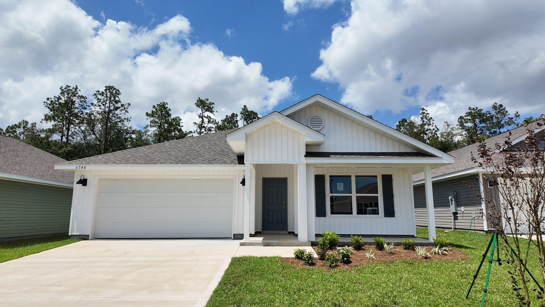 Welcome to Rivers Cove featuring a beautiful community pool and playground. The Cali model, one of our most sought-after designs, offers a fantastic open layout for relaxed living. Offers 4 bedrooms, 2 bathrooms, a covered back patio, 2-car garage, and the 'Smart Home Connect' System with various convenient Smart Home devices. The well-appointed kitchen includes stainless steel appliances, a smooth-top range, built-in microwave, quiet dishwasher, corner pantry, island bar, eye-catching wood-look flooring, and plush carpet in the bedrooms. Bedroom 1 and the adjoining beautiful bath boast a large walk-in closet, double vanity sinks and more. Fabric Hurricane window and door protection is also included. ALL LISTING pictures, colors, features, and size may vary. Square footages are approximate.