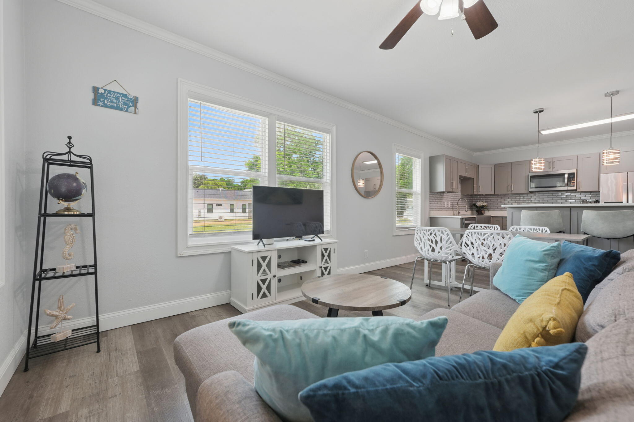Motivated Seller!! BRING ALL OFFERS!! Ask about Seller paying closing costs! Rental projections coming in at over $35,000 yearly! Welcome to this charming and FULLY FURNISHED 3-bedroom, 2-bathroom home located in the heart of Pensacola. Just minutes from downtown and 15 minutes from the stunning white sands of Pensacola Beach, this centrally located gem offers the perfect blend of stylish upgrades and convenience. Completely renovated from top to bottom in 2021, every detail of this home has been thoughtfully designed with modern living in mind. Step inside to an open-concept floor plan filled with natural light, neutral paint, and luxury vinyl plank flooring throughout. The spacious living area flows seamlessly into a stunning kitchen that's truly the heart of the home! Enjoy cooking wit h stainless steel appliances, a gas range stove, quartz countertops, soft-close cabinetry, a striking backsplash, and an oversized island complete with built-in storageperfect for entertaining or casual dining. The primary suite offers a relaxing retreat with a spacious layout and an ensuite bathroom featuring a luxurious freestanding tub. Two additional bedrooms are located toward the back of the home, connected by a beautifully updated full bathroom boasting a large walk-in shower and quartz-topped vanity. The home also features a large laundry area for added storage. Outside, the fully fenced backyard boasts mature shade trees and an open deckideal for relaxing or entertaining. Whether you're looking for a primary residence, a vacation home, or a turnkey rental property, this beautifully updated home is ready to welcome you. Don't miss your chance to own a slice of Pensacola paradise!